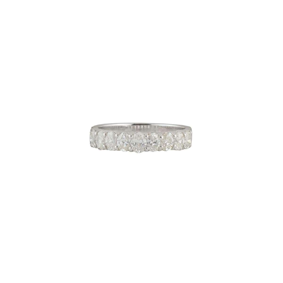 A traditional 14k white gold diamond eternity ring. The ring features 9 oval cut diamonds in a shared prong setting totalling to a weight of 1.08ct, G-I colour and VS-SI clarity. The ring is a size UK N/EU 53/US 6.5 but can be adjusted for a perfect