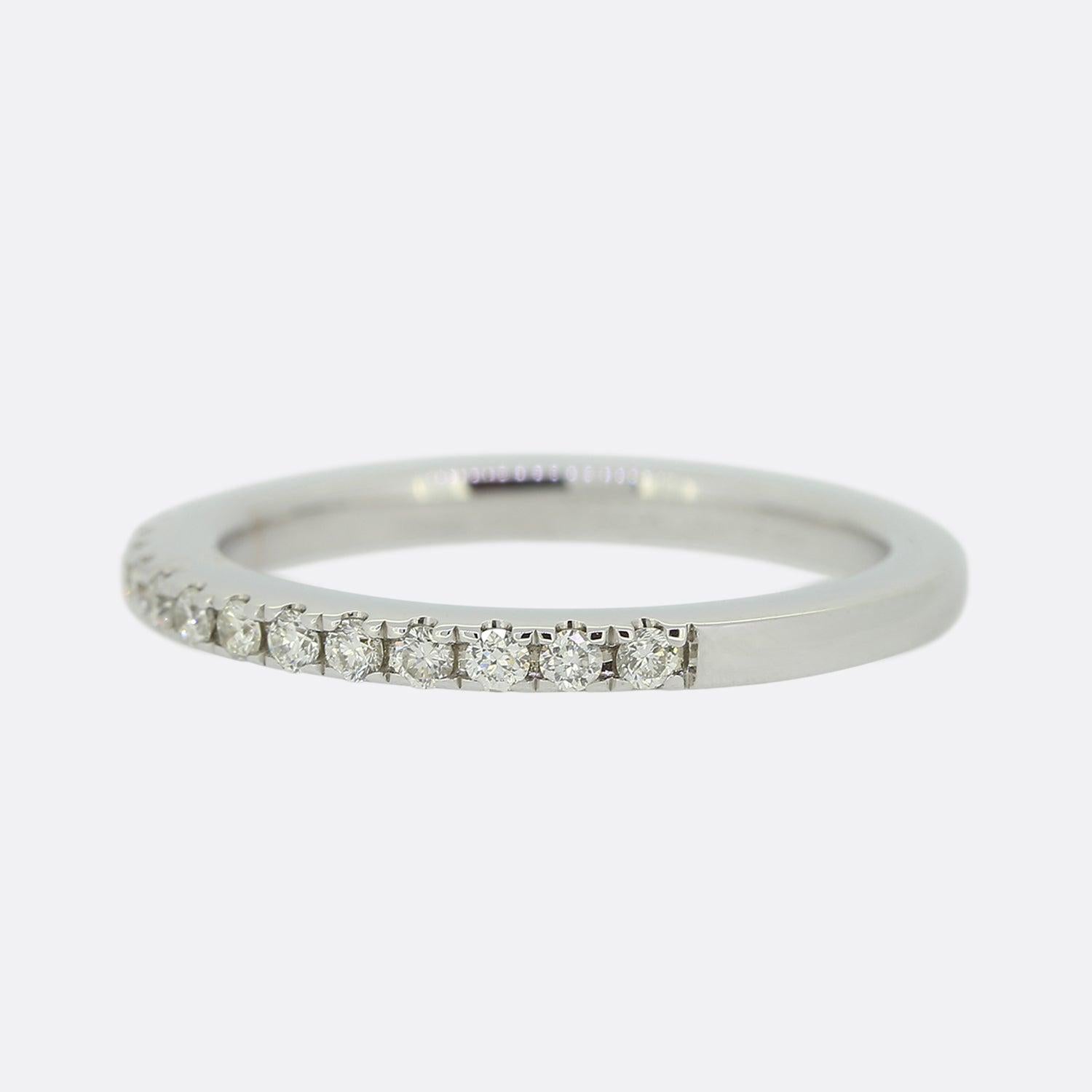 This is an 18ct white gold wedding band ring, set with 18 round brilliant cut diamonds that stretch across half of the band.

Condition: Used (Excellent)
Weight: 2.4 grams
Size: I
Band Width: 2mm
Total Diamond Carat Weight: Approx. 0.23