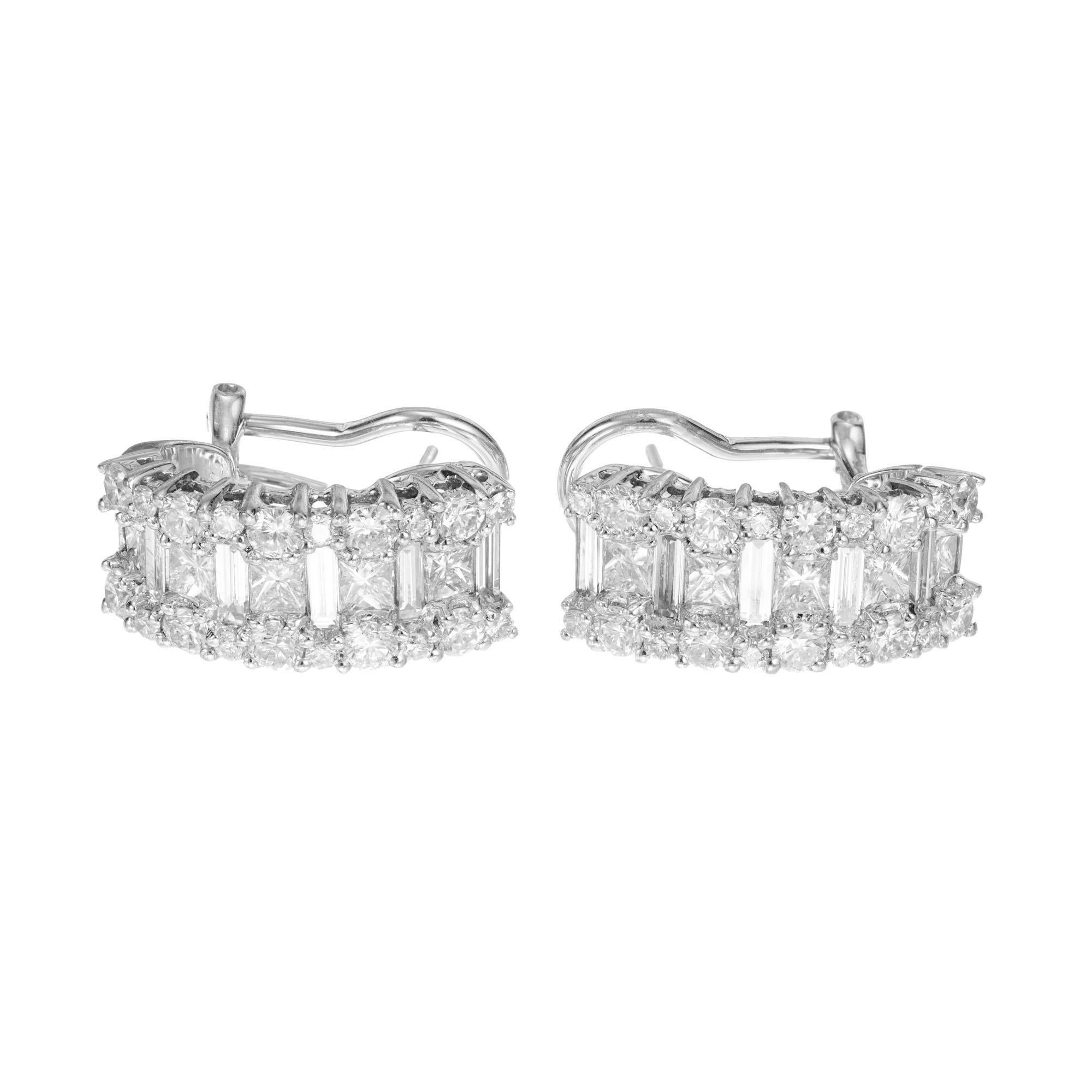 Half hoop diamond earrings. 10 princess and baguette cut diamonds each with two rows of round cut diamonds. Clip post settings in 18k white gold. 

10 princess cut diamonds approx. total weight: 1.00cts VS1, H-I
10 baguette cut diamonds approx.