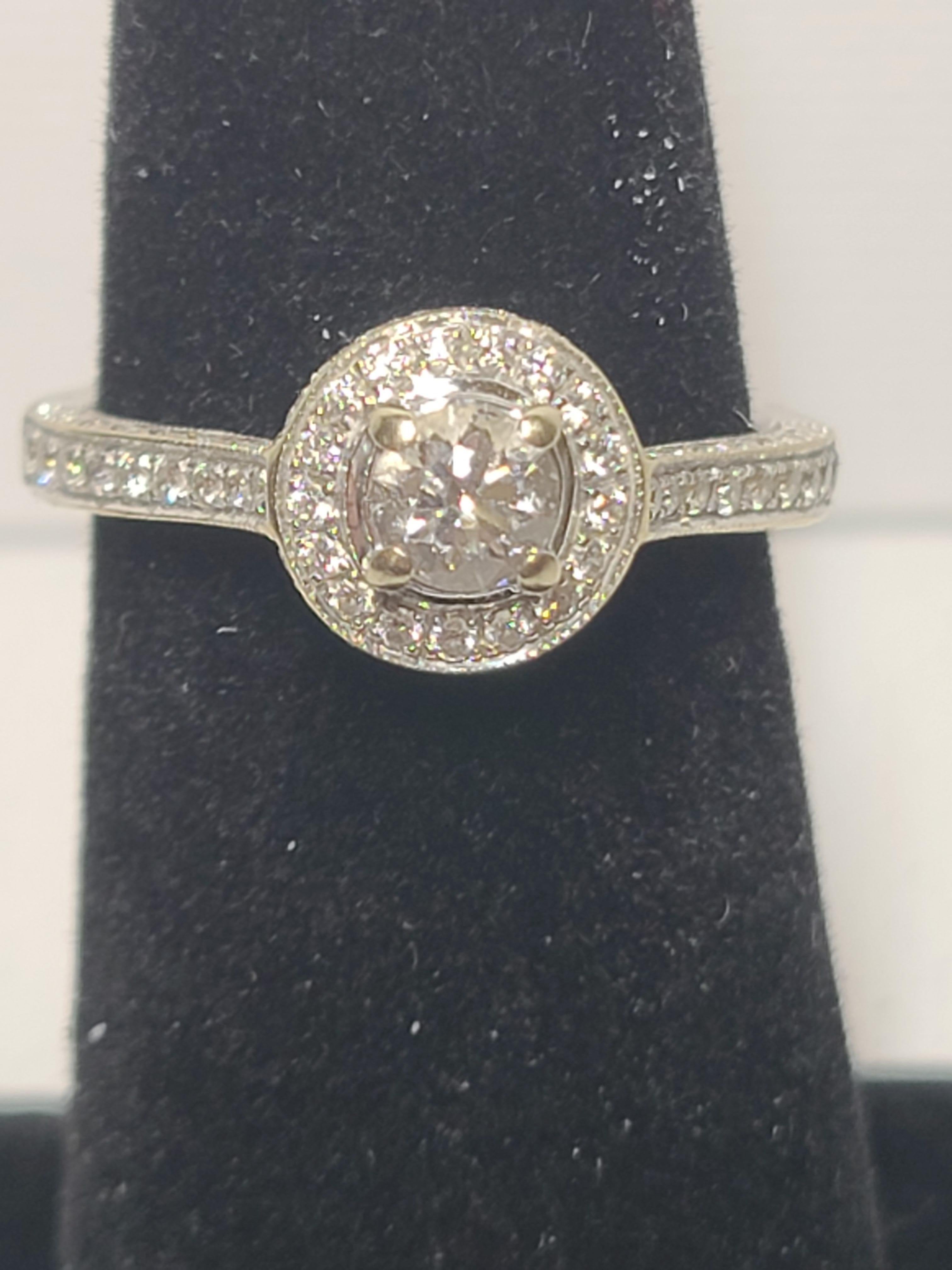 14K white gold diamond halo engagement ring with natural stones. Size 6.5. Total weight of 3.5 grams.