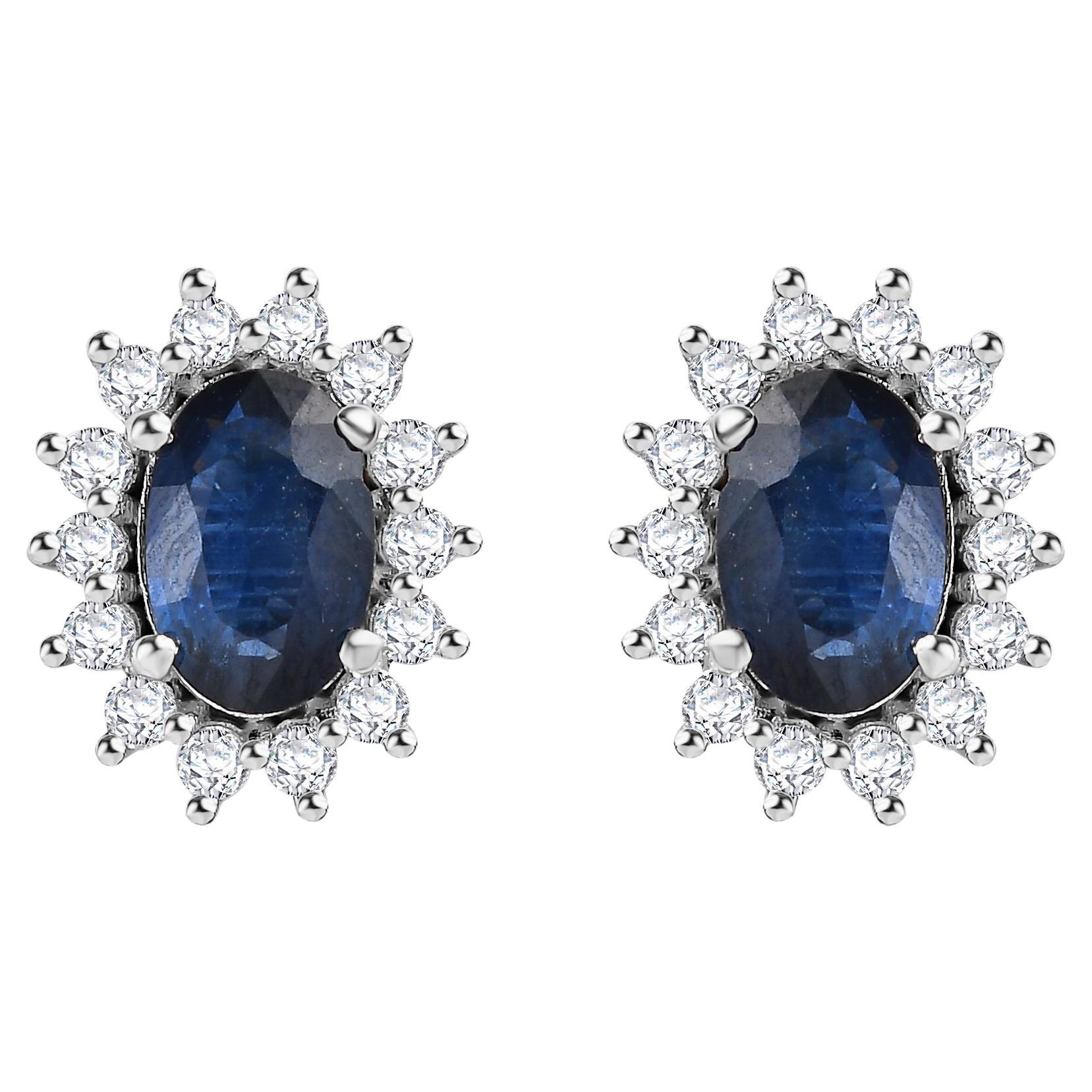 Pendientes Ovalados de Zafiro Azul Natural con Halo de Diamantes en Oro Blanco de 14k
