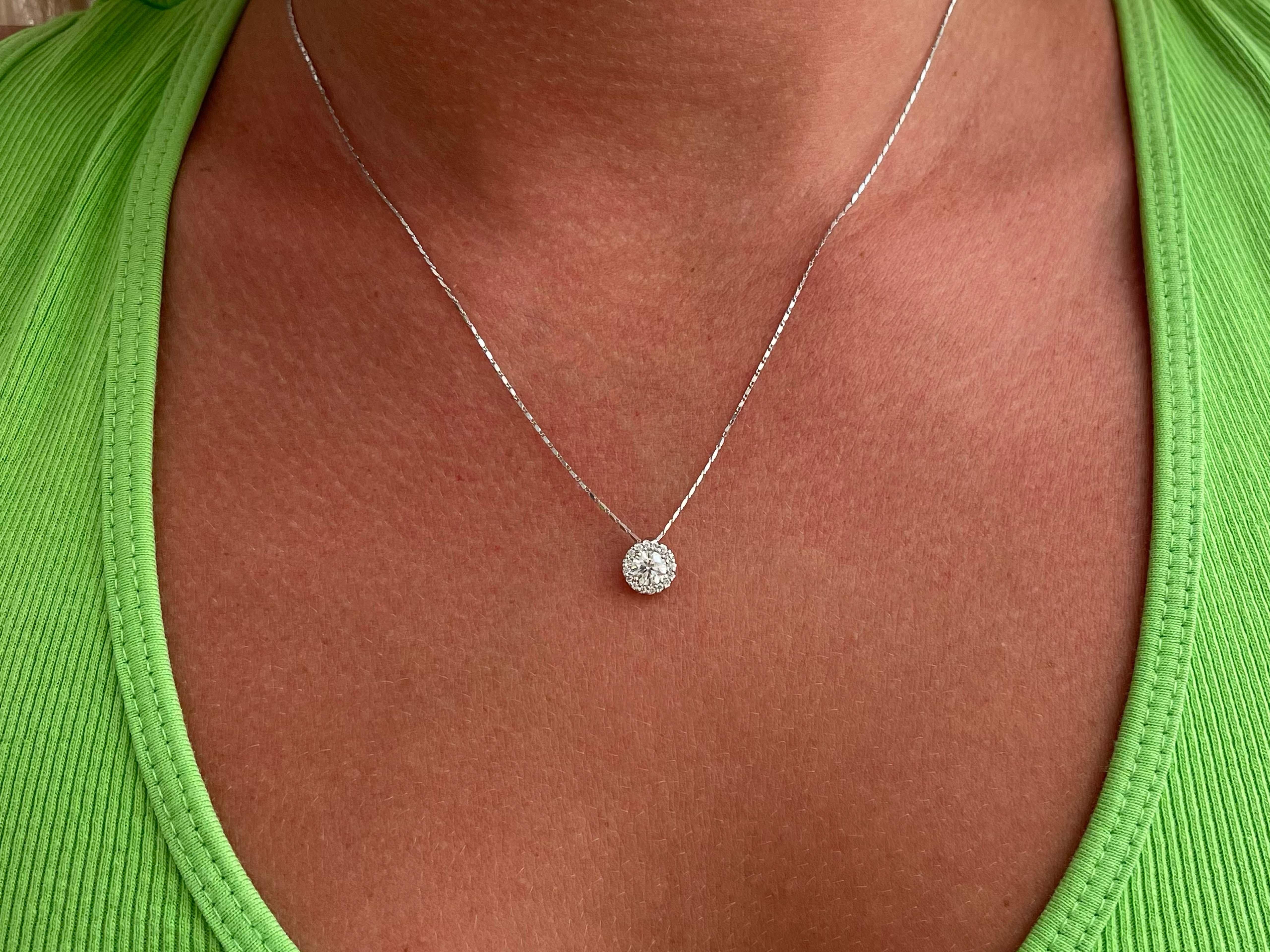 This gorgeous necklace features 17 round brilliant cut diamonds giving never ending sparkle in all angles. The center diamond is G in color and SI2 in clarity and the additional diamonds are G in color VS2-SI1 in clarity. This necklace is