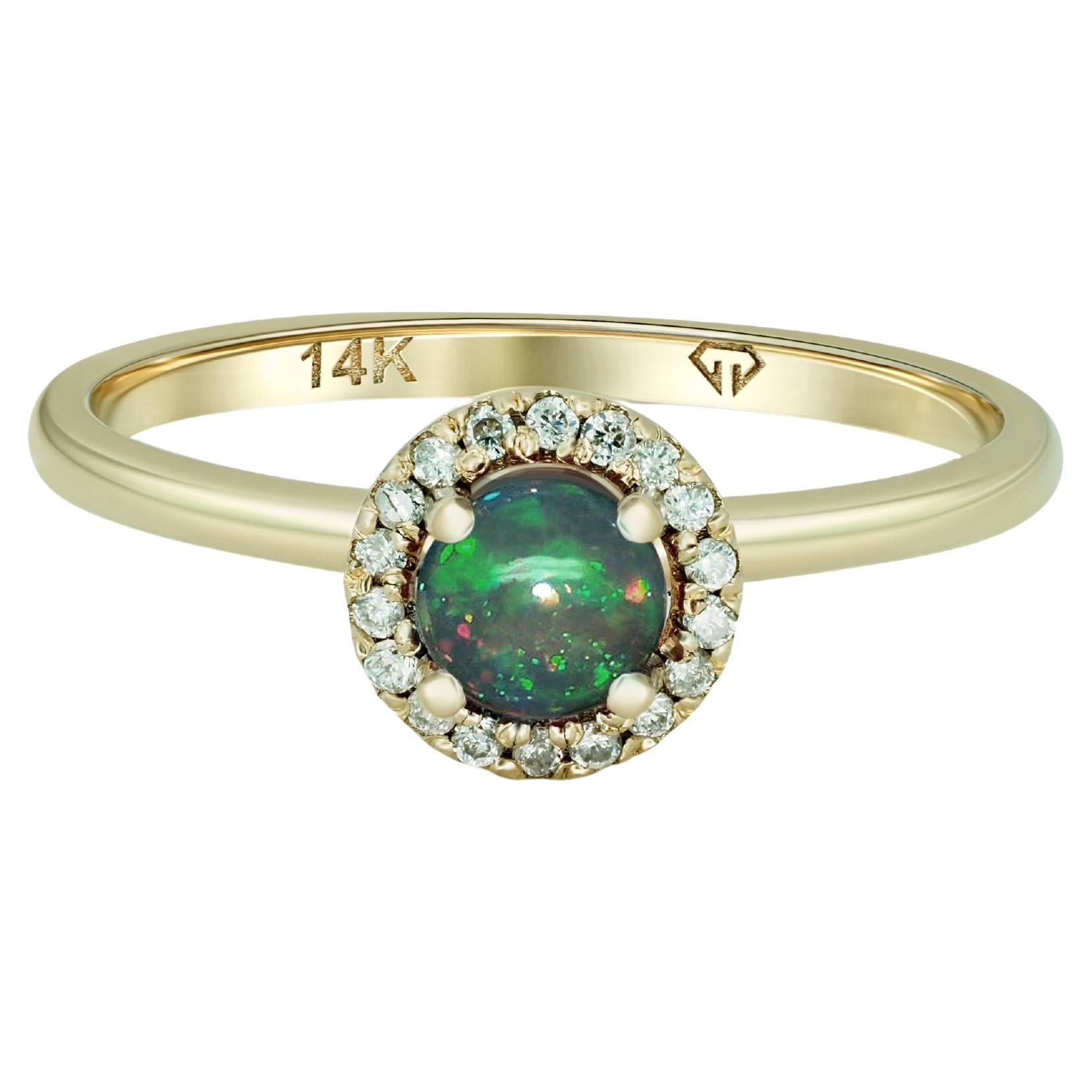 Diamond Halo Opal Ring in 14k Gold. 