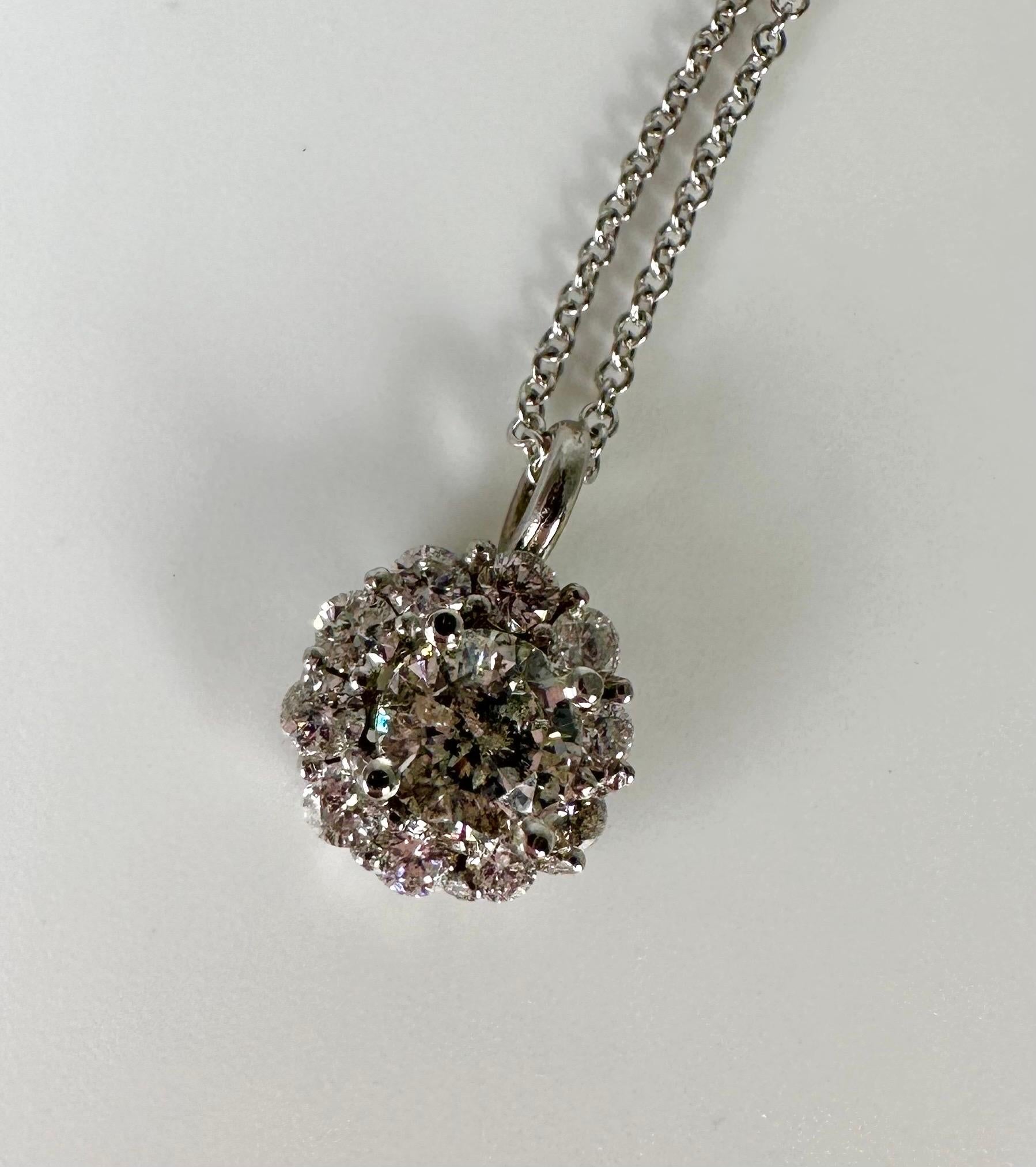 Stunning sparkling pendant necklace in 14KT whtie gold,made with natural diamonds of 1.43 carats in an open floral design. This necklace was handmade to perfection and hand finished for that extra sparkle!

METAL: 14KT gold
NATURAL