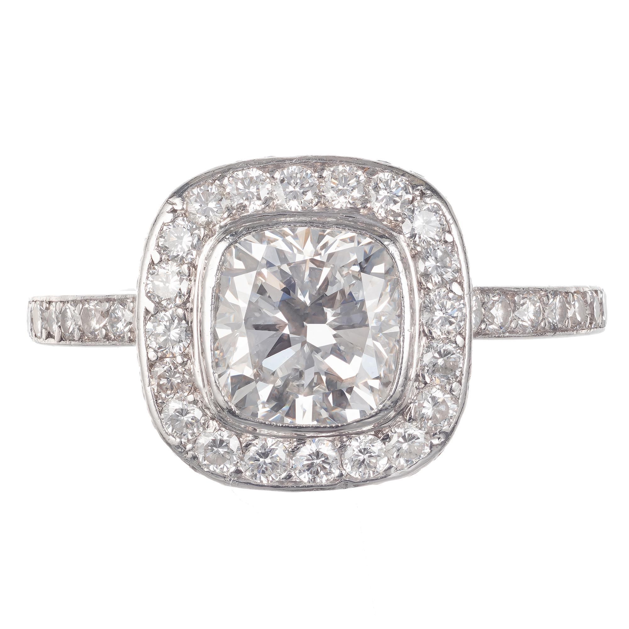 Halo design classic cushion top engagement ring with a cut cushion center diamond stone and a round diamond halo. GIA certified. 

1 cushion brilliant cut diamond, approx. total weight 1.51cts, F, VS2, Ideal cut, 6.96 x 6.52 x 4.42mm, Depth: 67.8% 