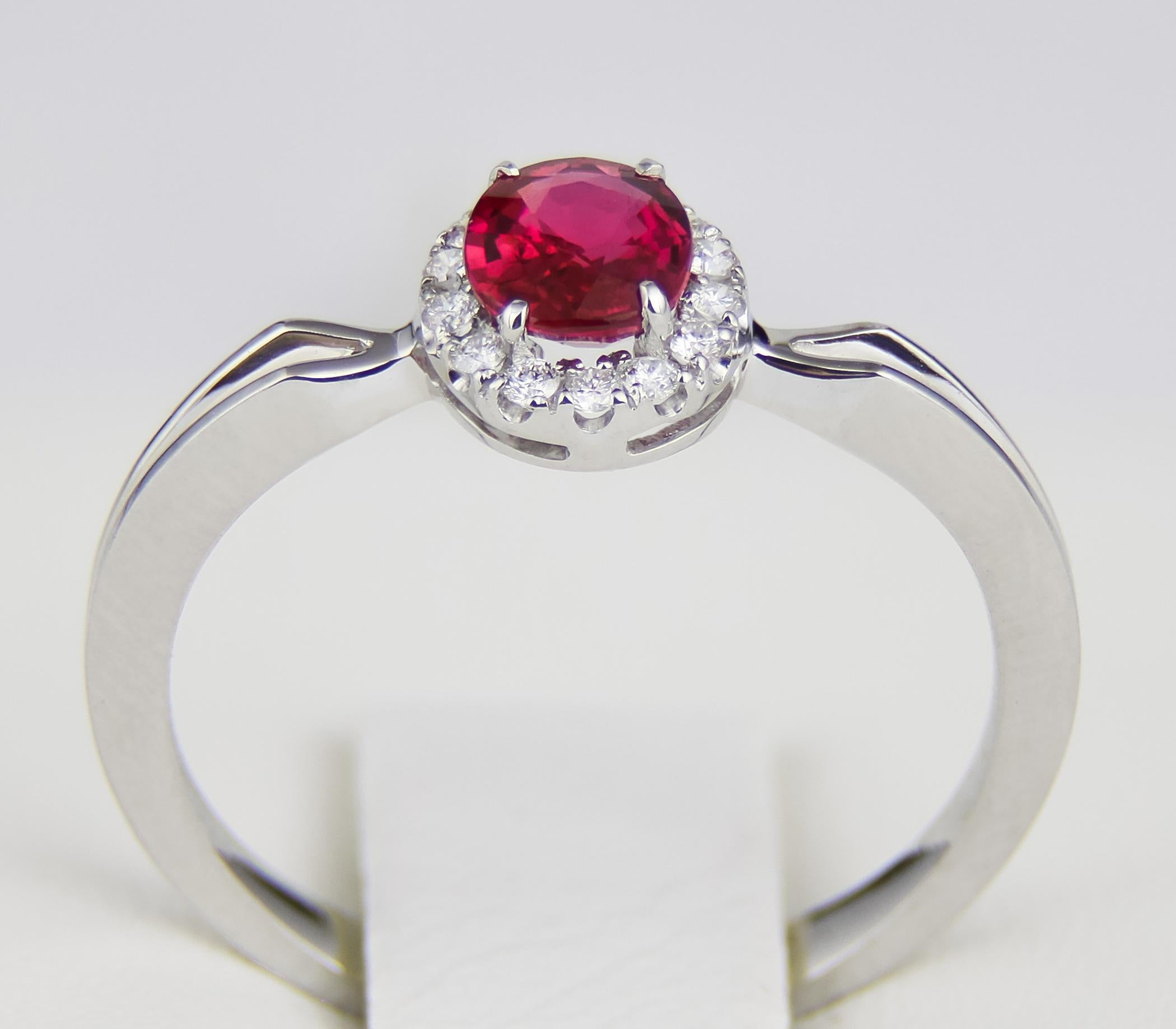 Oval Cut Diamond halo ruby ring.  For Sale