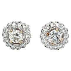 Clous d'oreilles halo de diamants en or blanc 18 carats