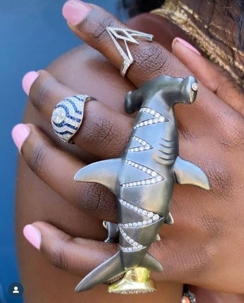 Swimming across the wearer's hand, this brilliantly-designed Hammerhead enlists the help of two pilot fish to secure the ring in place around the backs of several fingers.
This gentle giant is not messing around - he boldly empowers the wearer and