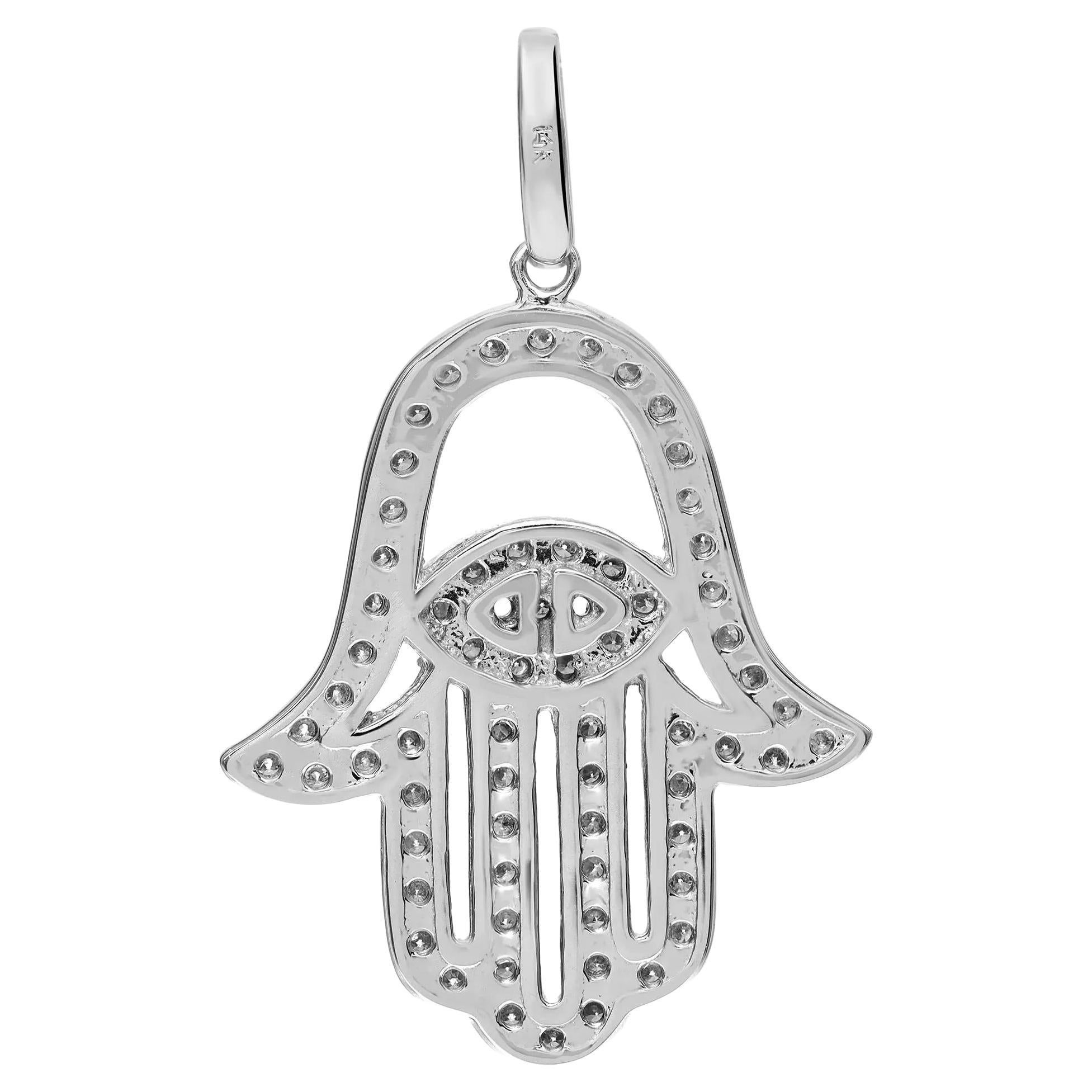 This majestic Hamsa pendant features pave set sparkling round cut diamonds. Total diamond weight: 0.62 carat. The pendant is crafted in 14K white gold. Diamond color I and SI clarity. Pendant size: 0.9 inch x 1.4 inches. Total weight: 3.58 grams.