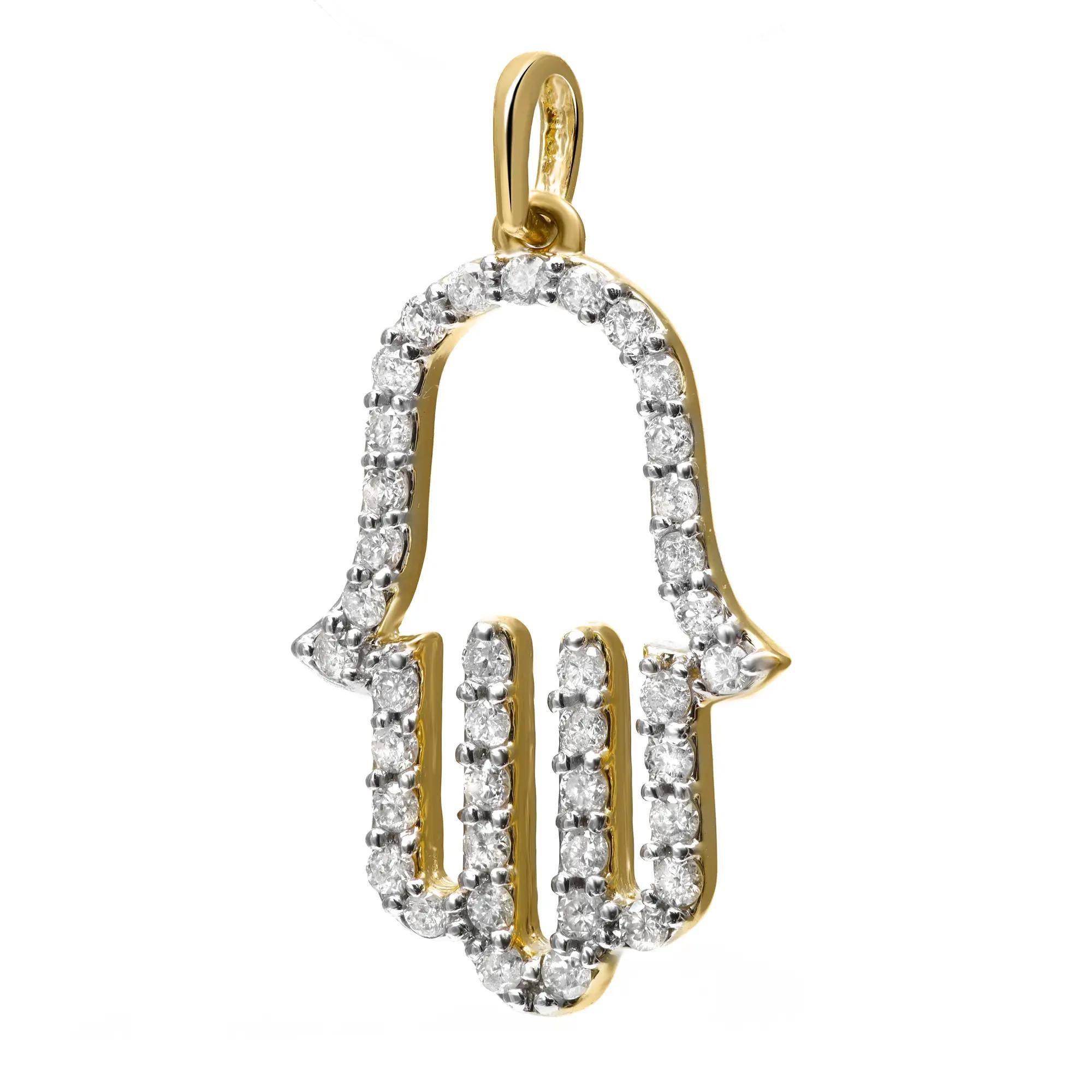 Classic and timeless hamsa pendant, crafted in 14k yellow gold. It features prong set round cut diamonds studded in a Hamsa cut out pendant. Total diamond weight: 0.33 carat. Diamond quality: I color and SI clarity. Pendant size: 13mm x 24mm. Total