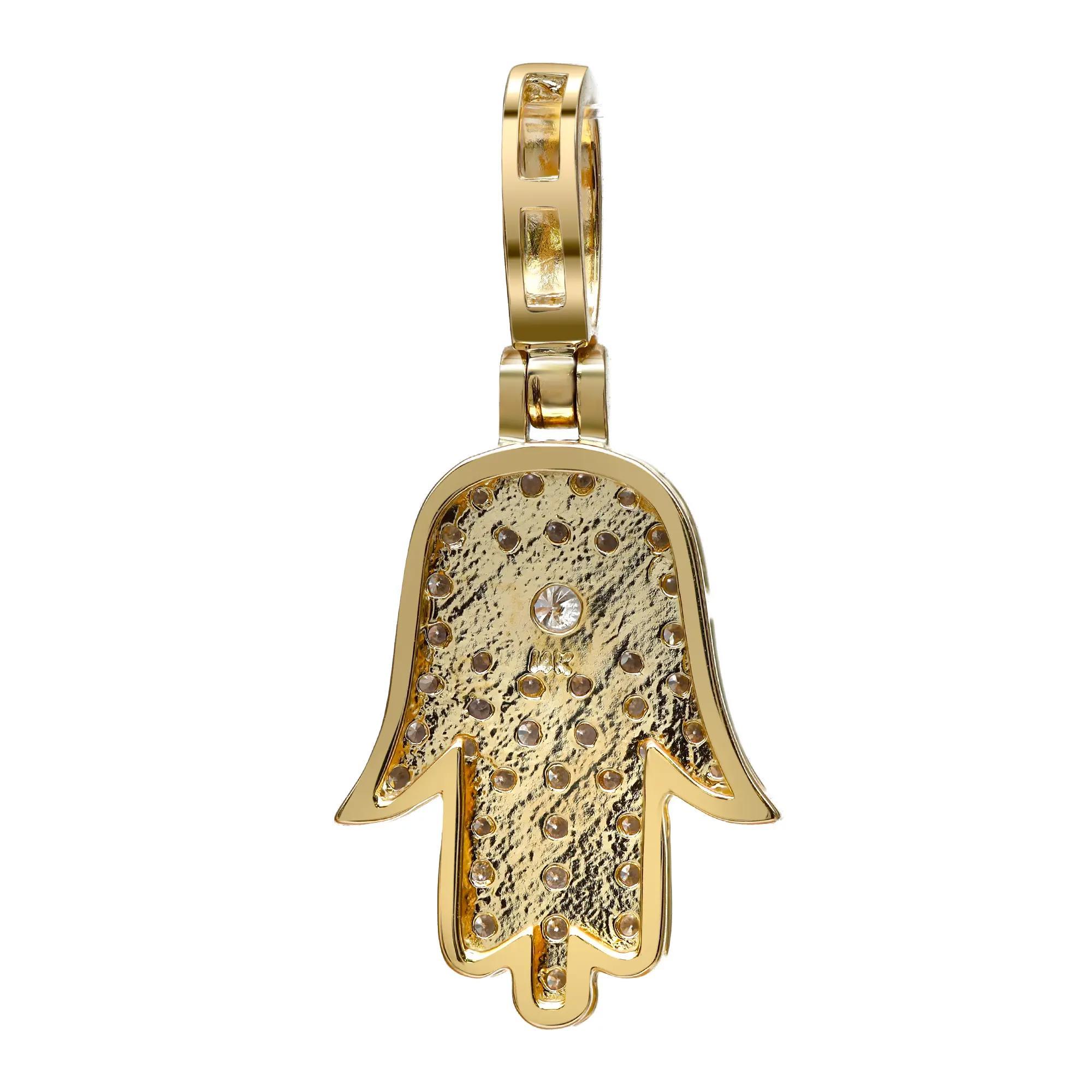 This majestic Hamsa pendant features pave set sparkling round cut diamonds. Total diamond weight: 0.50 carat. The pendant is crafted in 14K yellow gold. Diamond color I and SI clarity. Pendant size: 0.5 inch x 1.1 inches. Total weight: 3.31 grams.