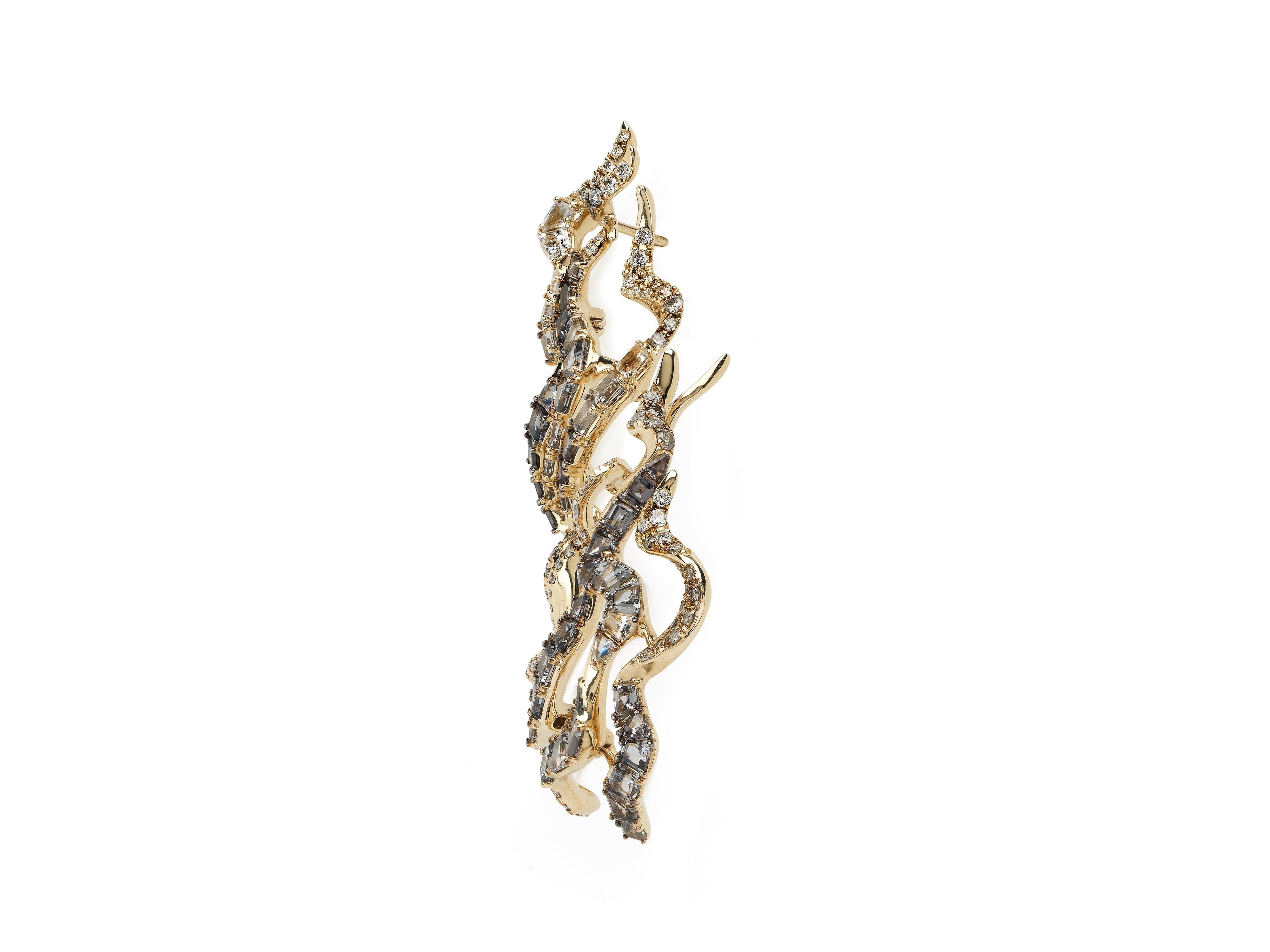 The Haze Earrings’ intricate, delicate design makes a striking statement. These drop earrings are composed of multiple ‘swirls’ connected by tiny hinges, so the earrings move with the wearer, conjuring the fluidity of an ever-changing haze of smoke.