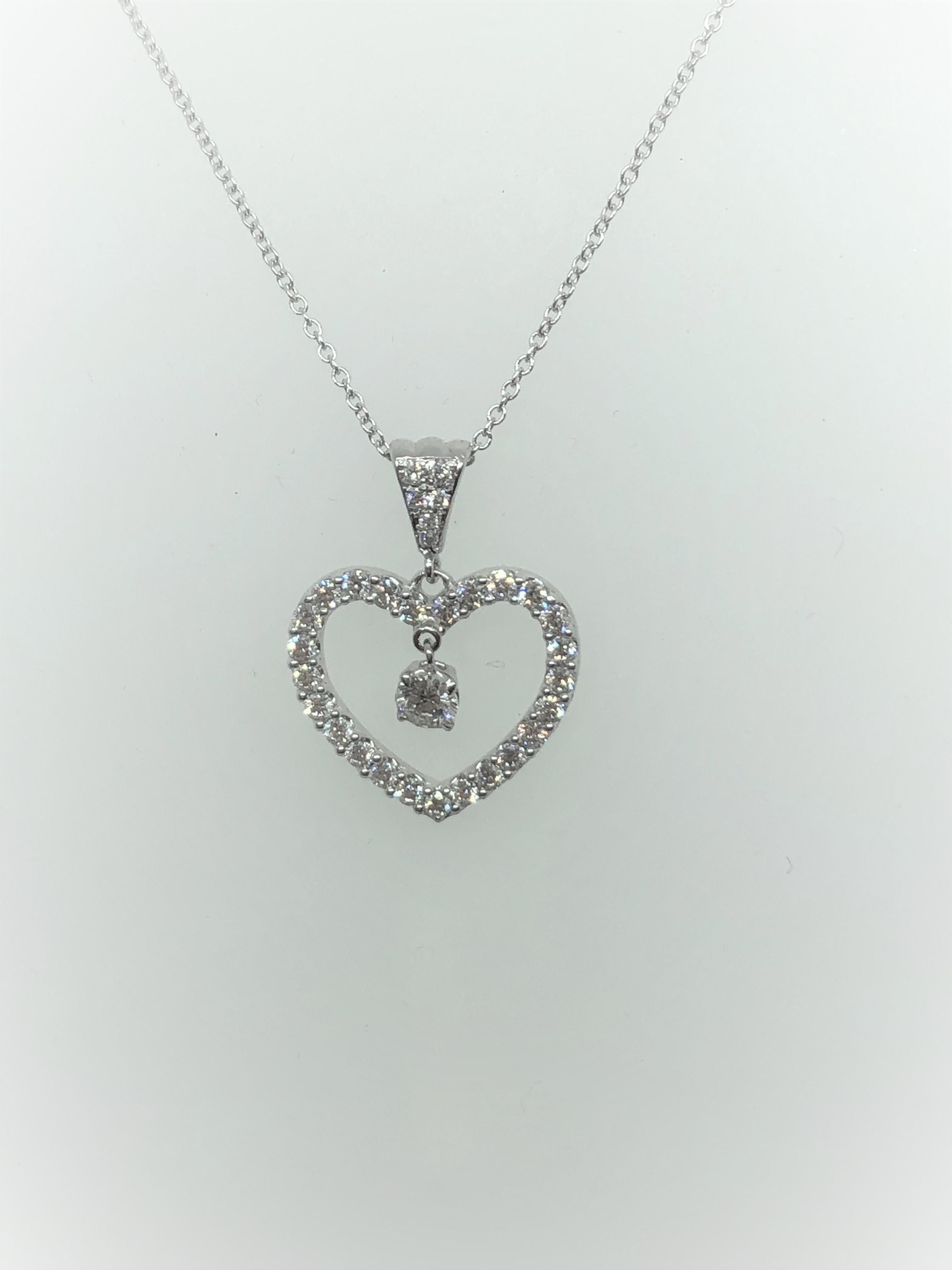 Diamond Heart 0.89 Carats Necklace/Pendant 14K White Gold

Center Stone weighs 0.20 carat

Total Carat Weight of Small Diamonds 0.69 carat

D/E Color, VVS/VS Clarity

Total Carat Weight 0.89 carats

Set in 14K  White Gold 

With 16