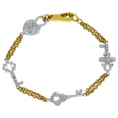 Diamond Heart and Key Designer Bracelet in 18 Karat Yellow and White Gold