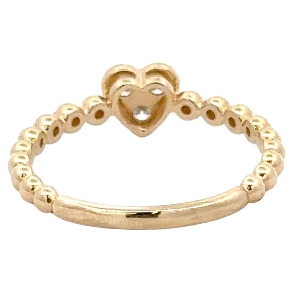 Or jaune 14 carats présentant trois brillants ronds pesant 0,17 carats sur un anneau perlé.

Plus de bijoux de mode en stock
Message pour photos et détails. 
Recherche Harbor Diamonds