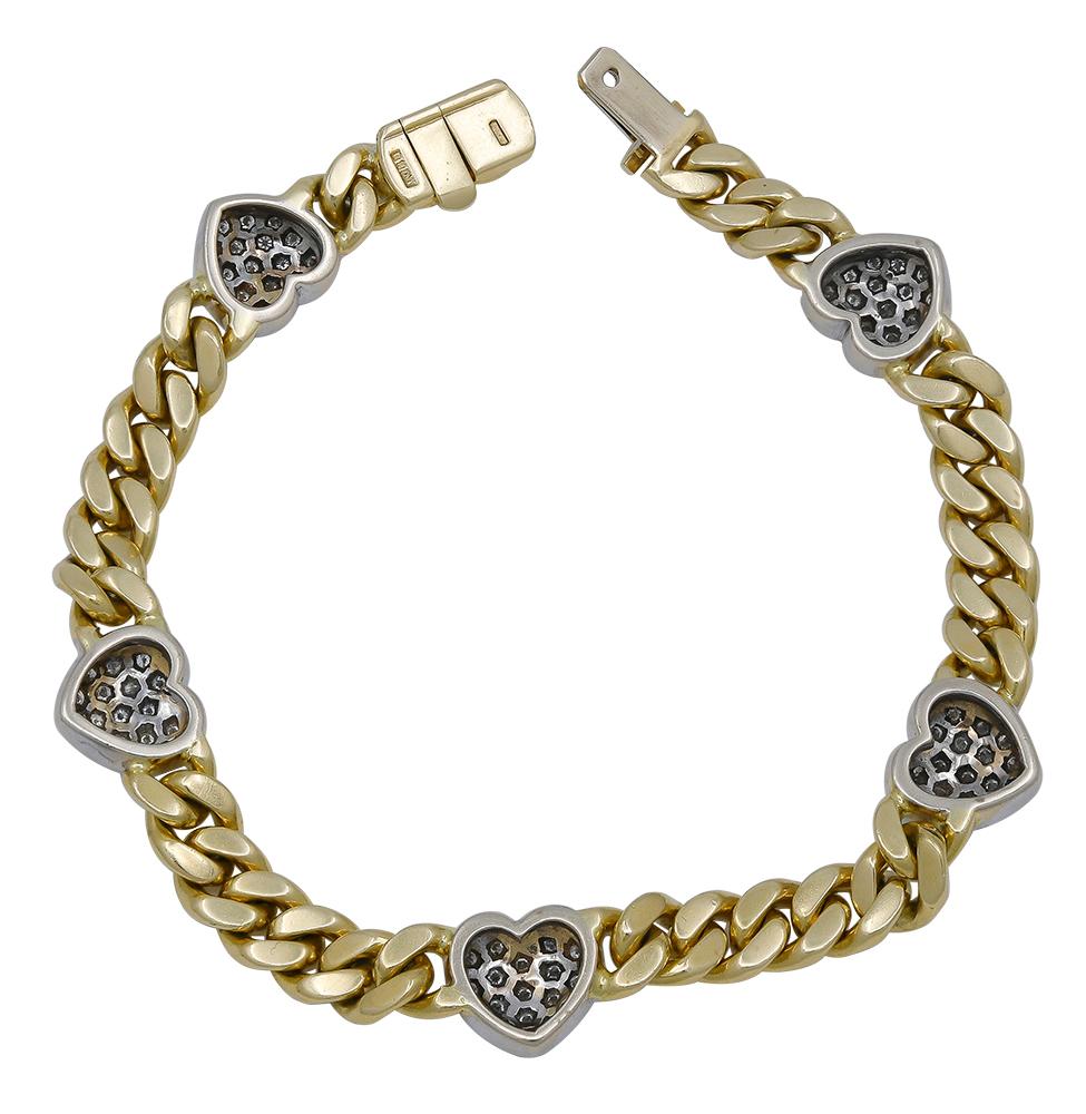 Solid flat Cuban link yellow gold bracelet, set with five hand-set pave figural hearts, set in white gold.  The hearts are slightly raised, creating a three-dimensional effect.  Approximately 2.50 carats of bright diamonds.  18K yellow gold. 7 1/2