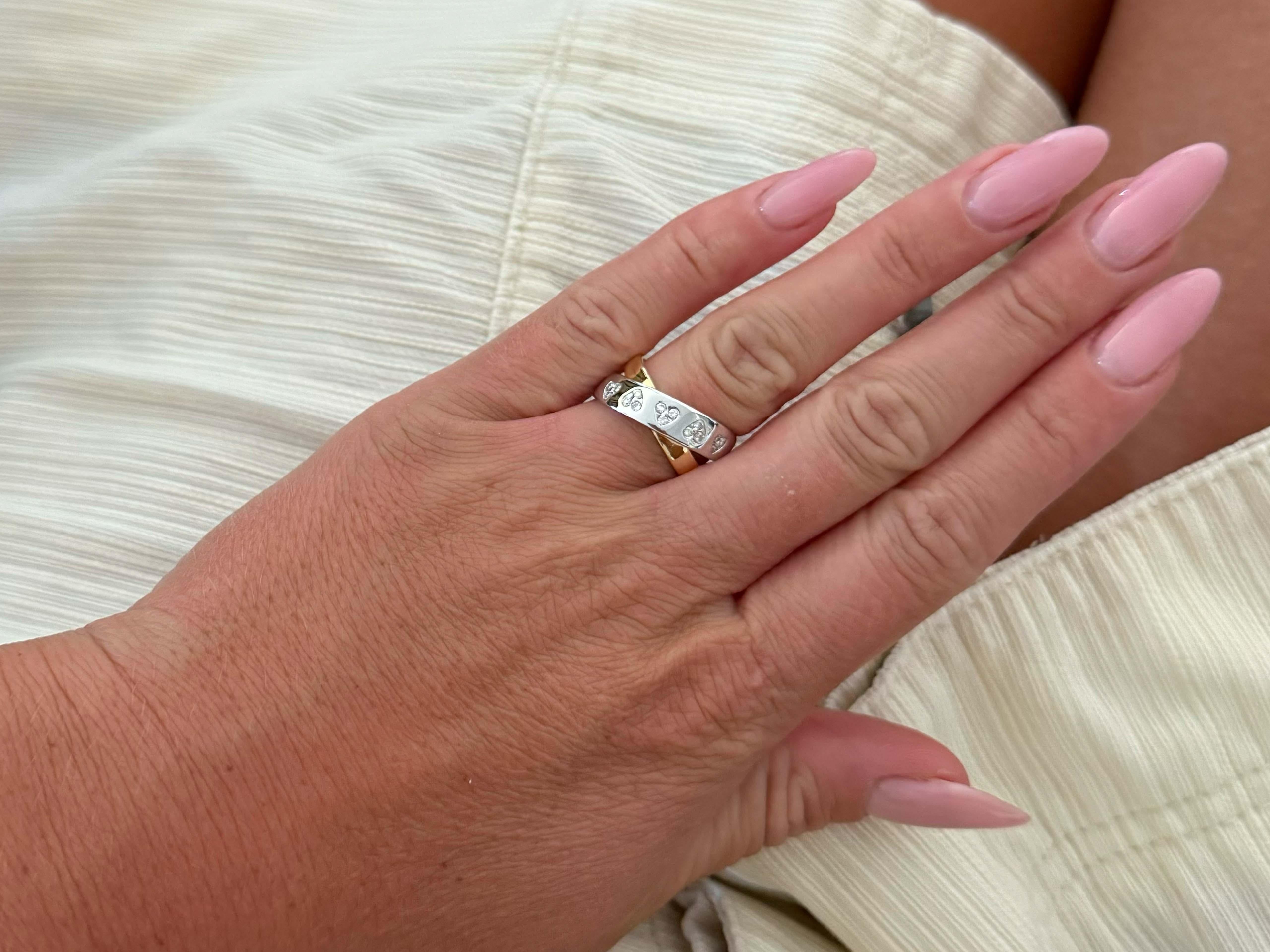 Item Specifications:

Metal: 18k Yellow and White Gold

Diamond Count: 15 brilliant cut

Total Diamond Carat Weight: ~0.10 carats 

Diamond Color: G-H

Diamond Clarity: VS

Ring Size: 6.75

Total Weight: 8.7 Grams

Stamped: 