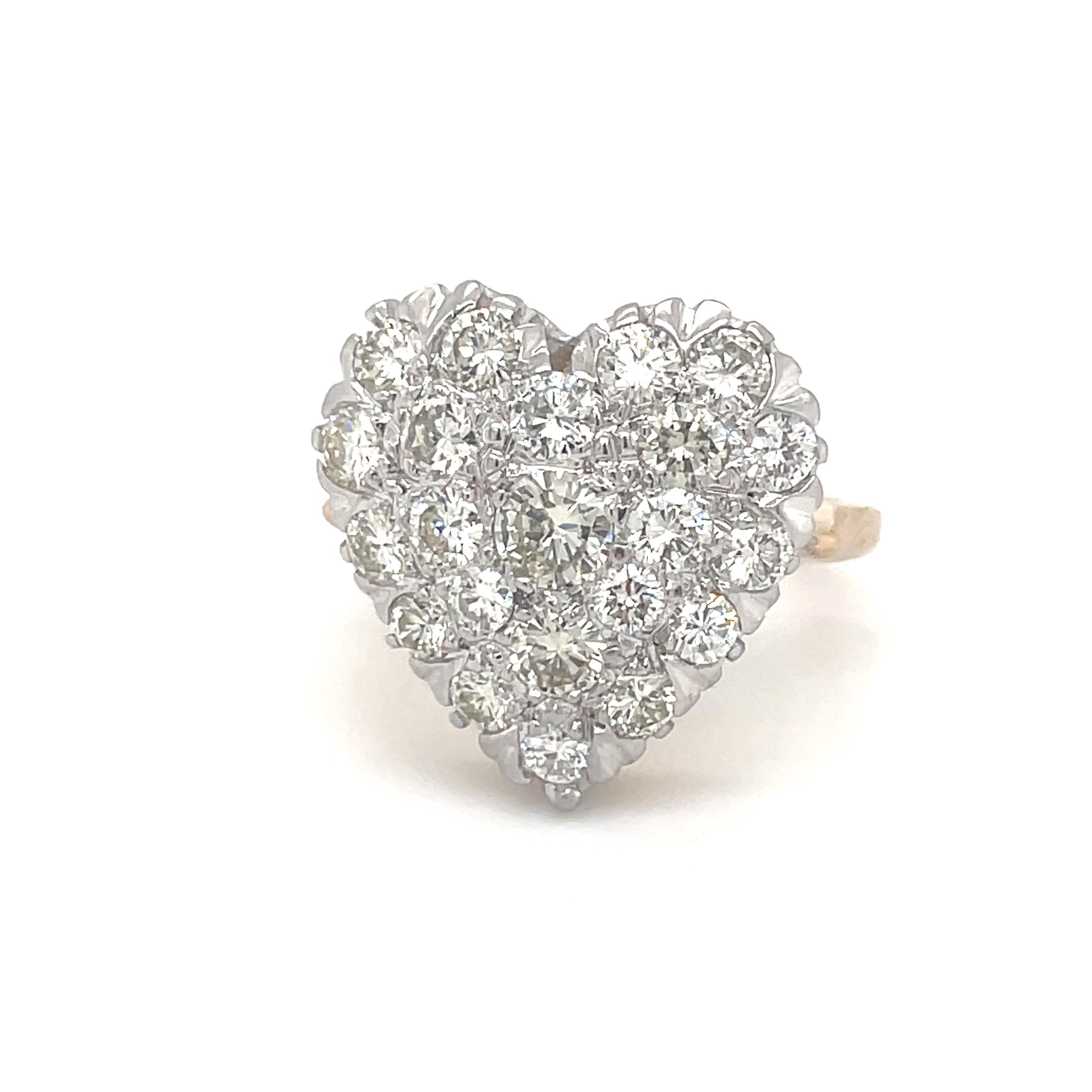  A bright eye-catching ring, set with a sparkling diamond heart.  14K yellow gold; the diamonds are set in white gold. With approximately 1.35 carats of diamonds.  Size 5 1/2; fits like a size 6. and can be custom-sized.  A bold look.  You can wear
