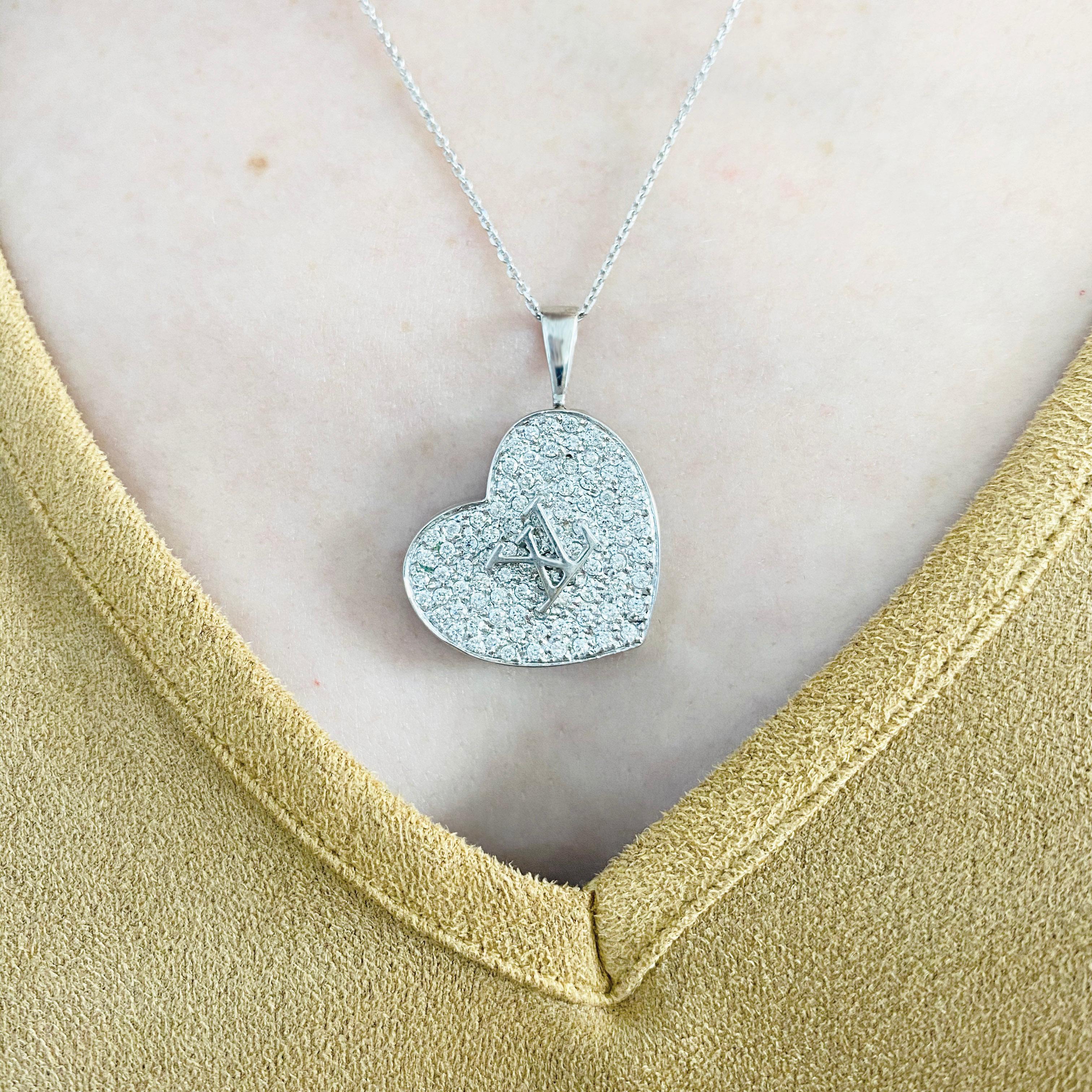 This gorgeous 18k white gold LV design heart locket pendant dripping with diamonds is the perfect mix between classic and trendy! This necklace is very fashionable and can add a touch of style to any outfit, yet it is also classy enough to pair