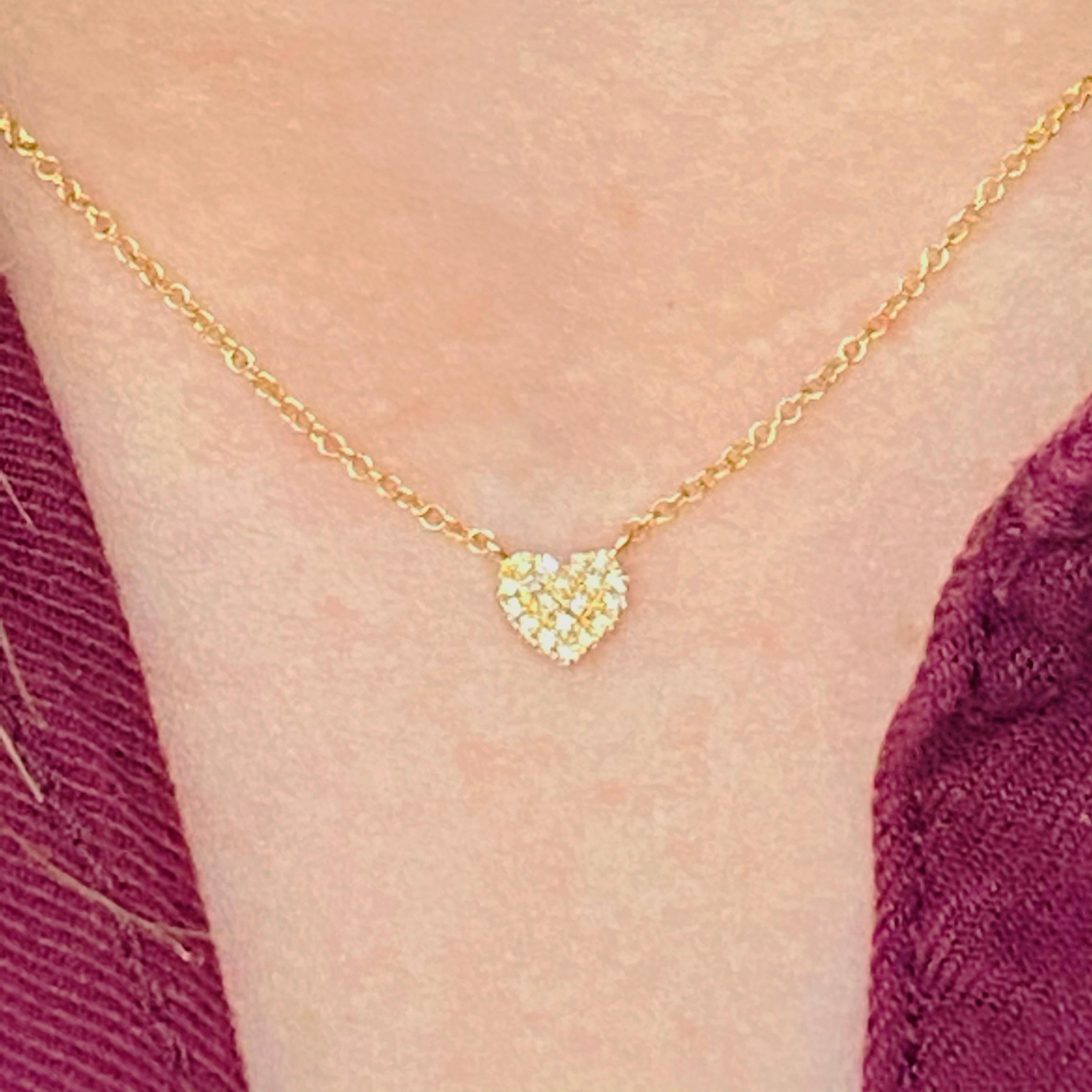 This gorgeous 14k yellow gold heart pendant with pave diamonds is sure to put a smile on anyone's face! This necklace looks beautiful worn by itself and also looks wonderful in a necklace stack. Its amazing adjustable chain design allows it to be