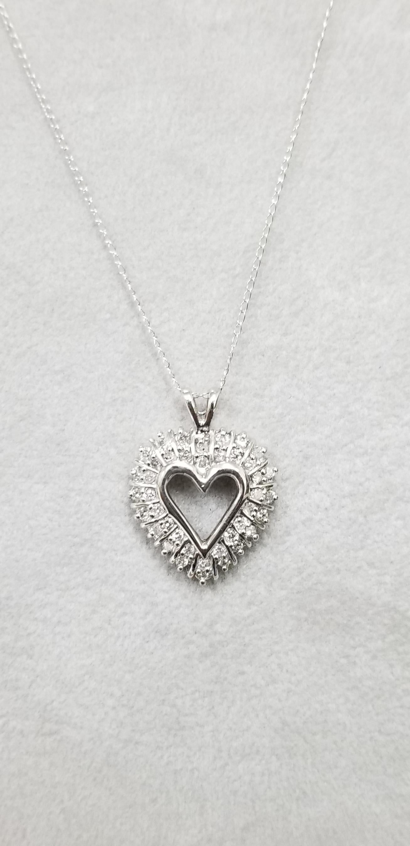 14k white gold diamond heart necklace, containing 40 round full cut diamonds of good quality weighing .60pts. on a 16 inch chain.