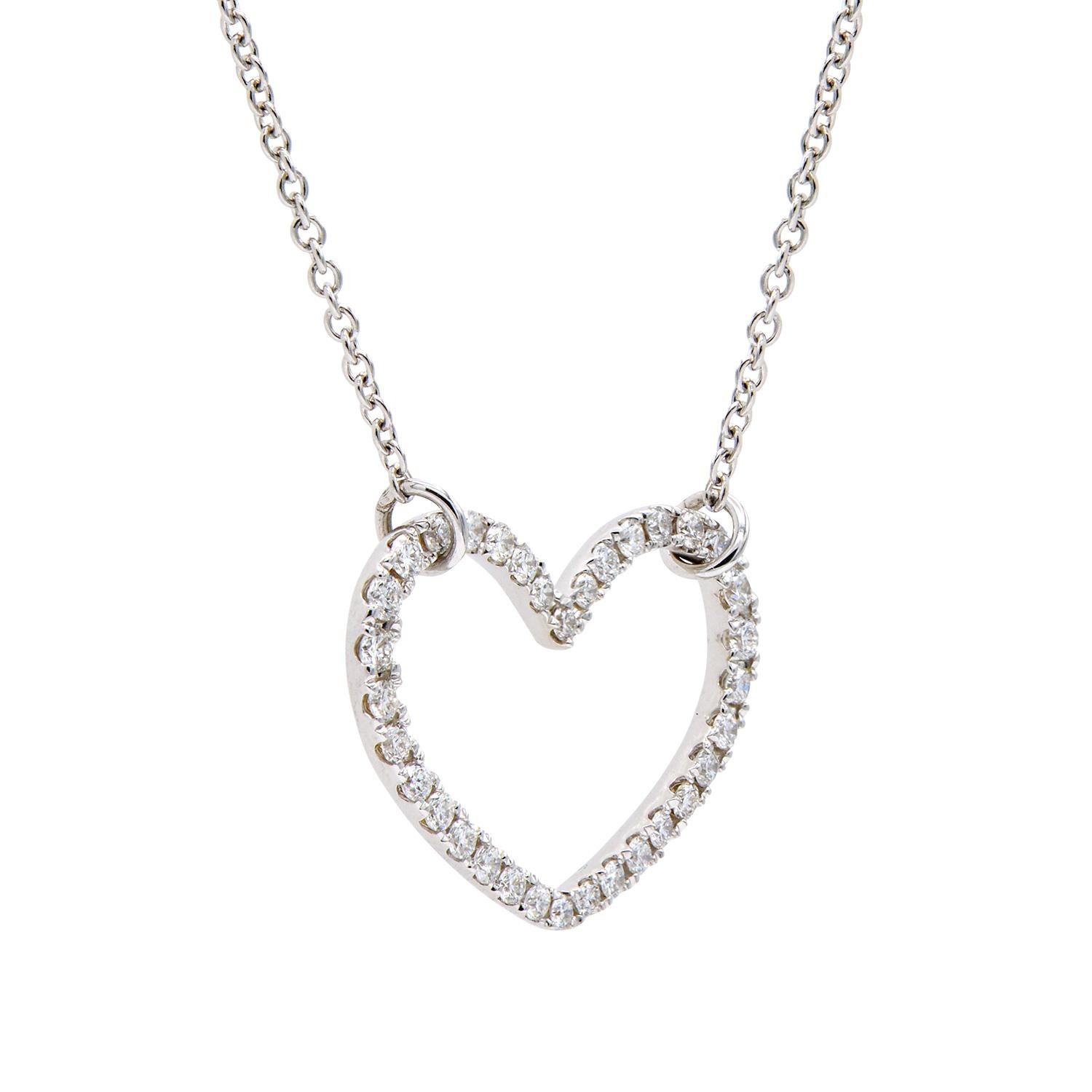 Show your love with this beautiful 18 karat white gold heart necklace enhanced with sparkling stunning diamonds. Each heart contains 34 round VS2, G color diamonds that total 0.32 carats which are set in 3.0 grams of white gold. Attached is an 18