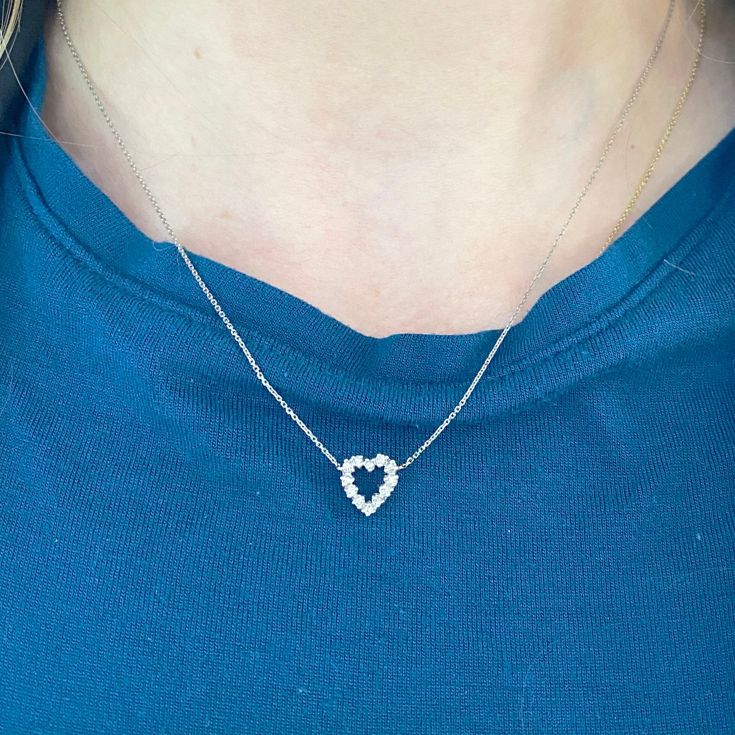 This gorgeous 14k white gold open heart pendant dripping with diamonds is sure to put a smile on anyone's face! This necklace looks beautiful worn by itself and also looks wonderful in a necklace stack. This necklace would make a wonderful gift for