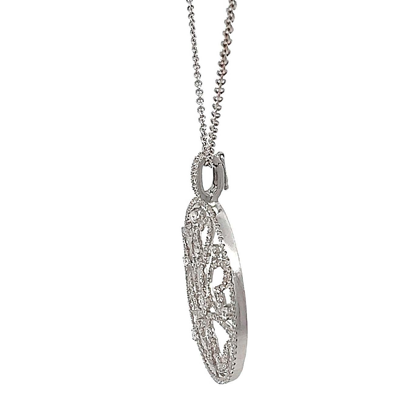 18k White Gold Circular Diamond Pendant Necklace. This exquisite necklace features a timeless diamond pendant on a delicate chain, making it the perfect romantic gift for any special occasion. with an eye-catching design, the circular pendant is