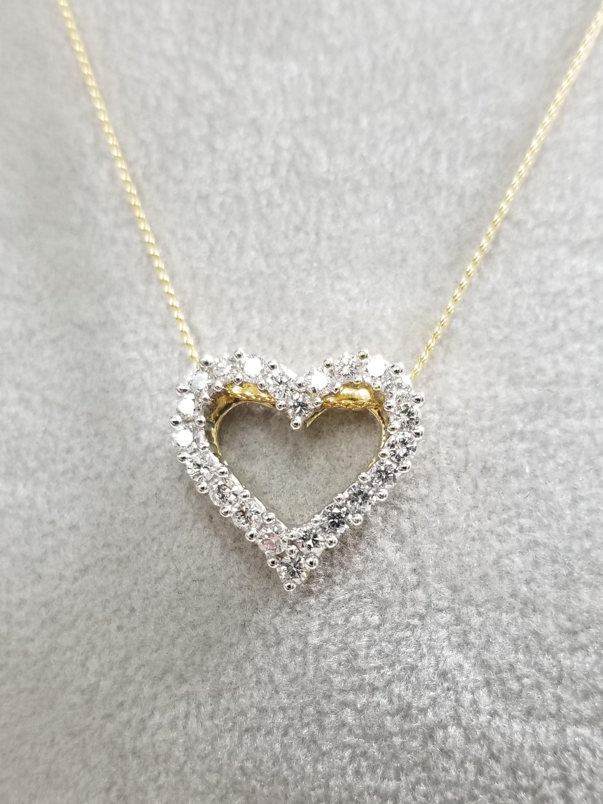 14k yellow gold diamond outlined heart, containing 22 round full cut diamonds of very fine quality weighing .70pts. on a 16 inch chain.