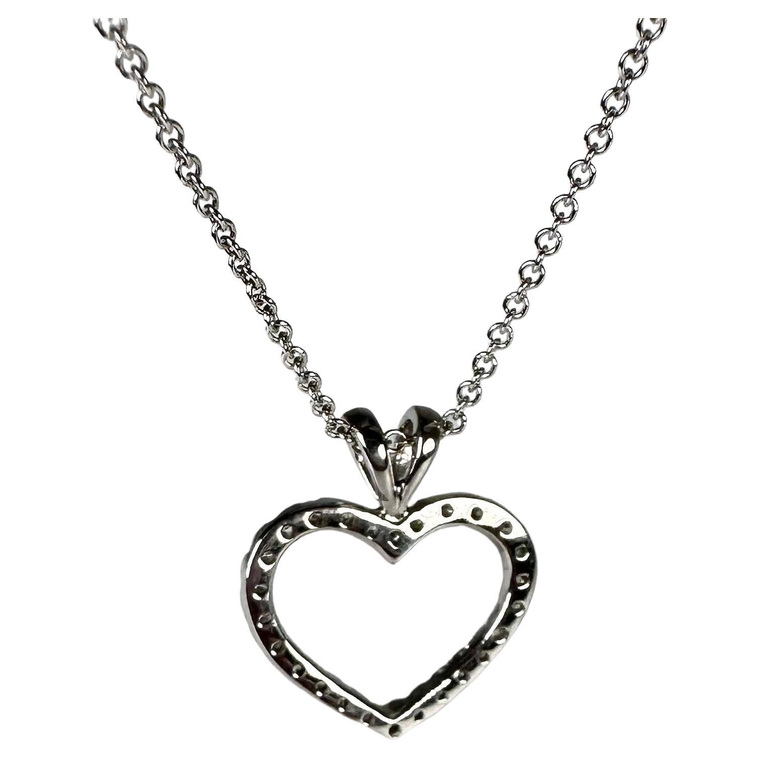 Modern large heart pendant necklace for that special someone! Amazingly crafted in 14KT white gold with 26 natural diamonds. Certified piece that will come with 18
