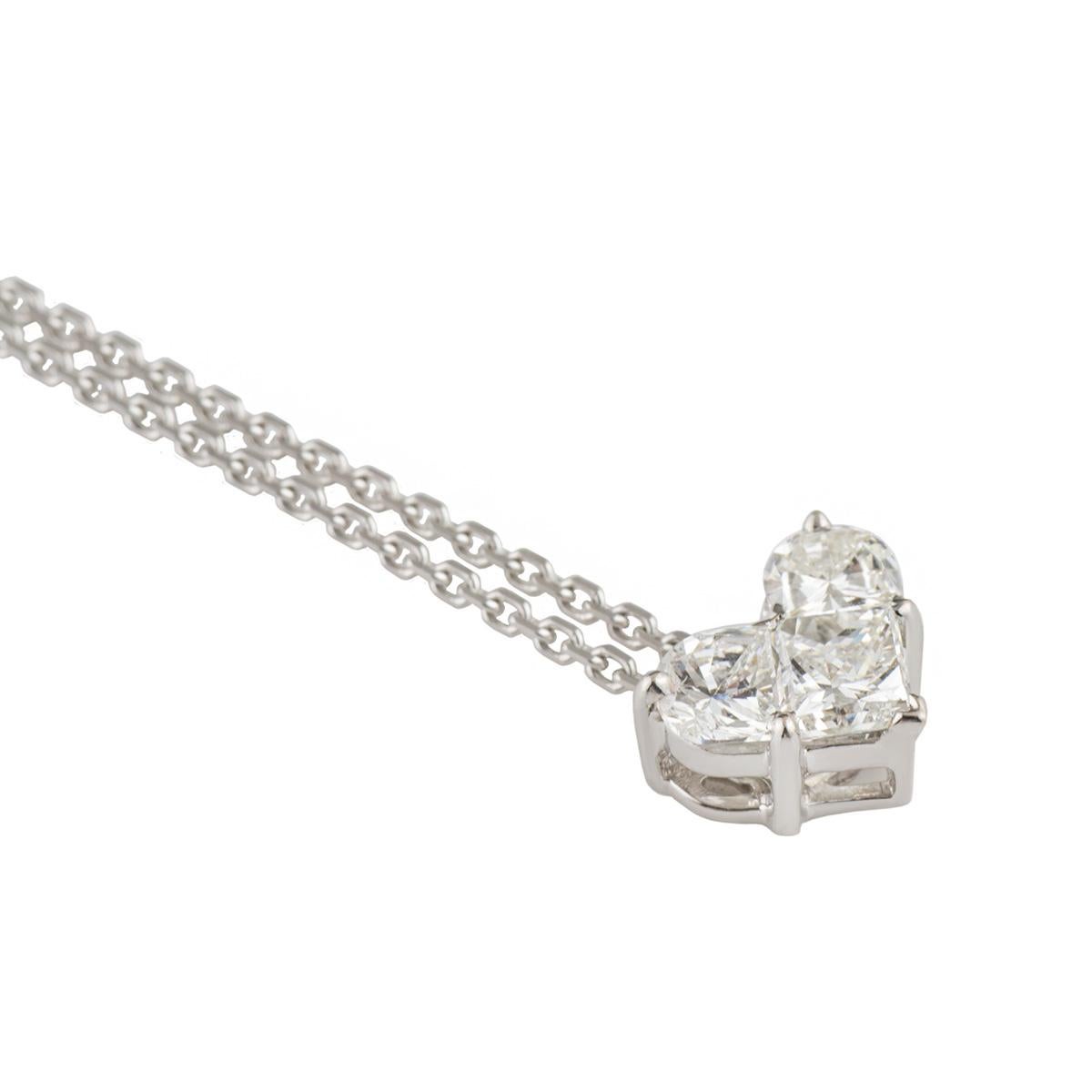 A sparkly 18k white gold diamond heart pendant. The pendant comprises of 2 half moon cut diamonds and a princess cut diamond to form a pure heart shape, with a total diamond weight of approximately 0.65ct, predominantly H colour and VS1 clarity. The