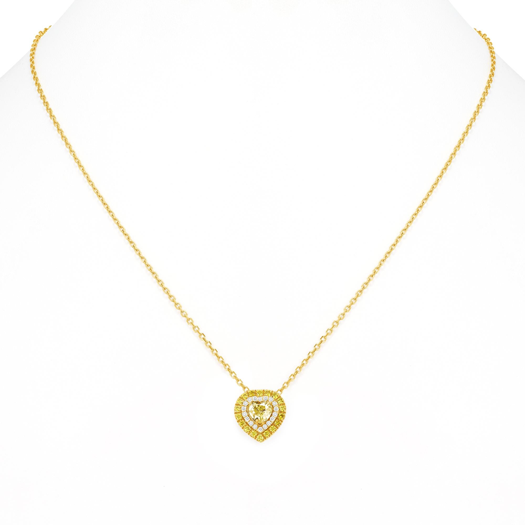 Heart Pendant Necklace with half a carat 
Fancy Yellow Genuine & Natural Diamond
.67 Round Brilliant Diamonds surrounding the center stone.