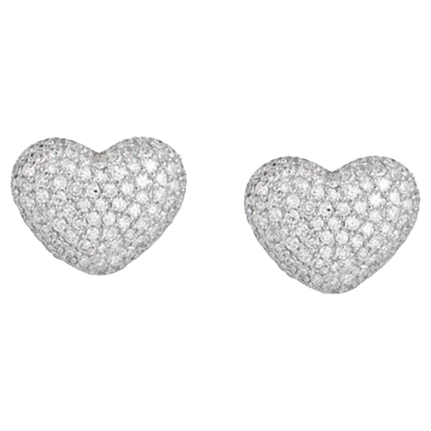 Orecchini a bottone in oro 14 carati con diamante a forma di cuore da 0,54 carati