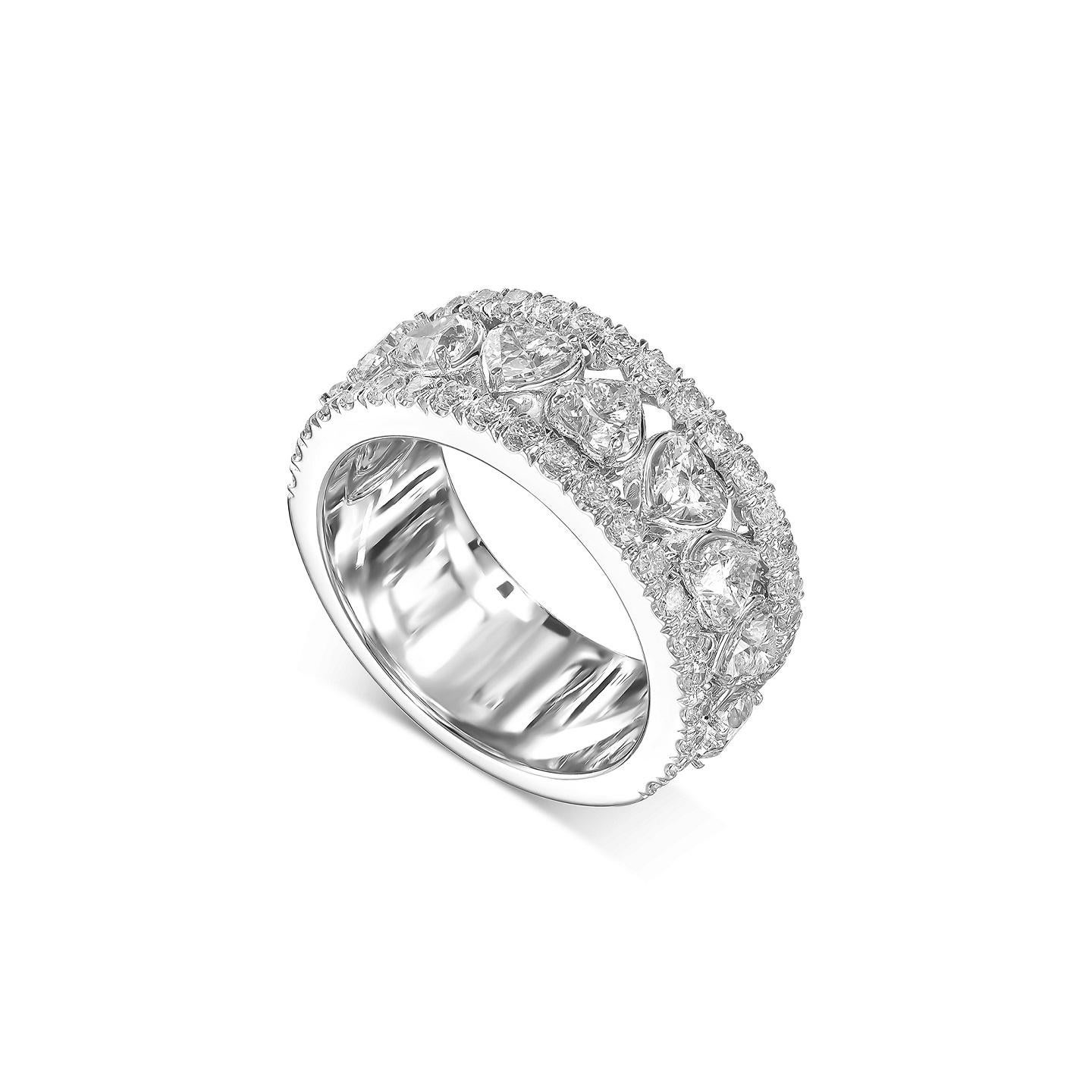 Our Dazzling Eternity Ring is handcrafted from heart shaped cut diamonds as well as round cut diamonds. Matching diamond hearts require perfection and knowledge which translates to an eye catching lushness. The high quality diamonds are mounted on