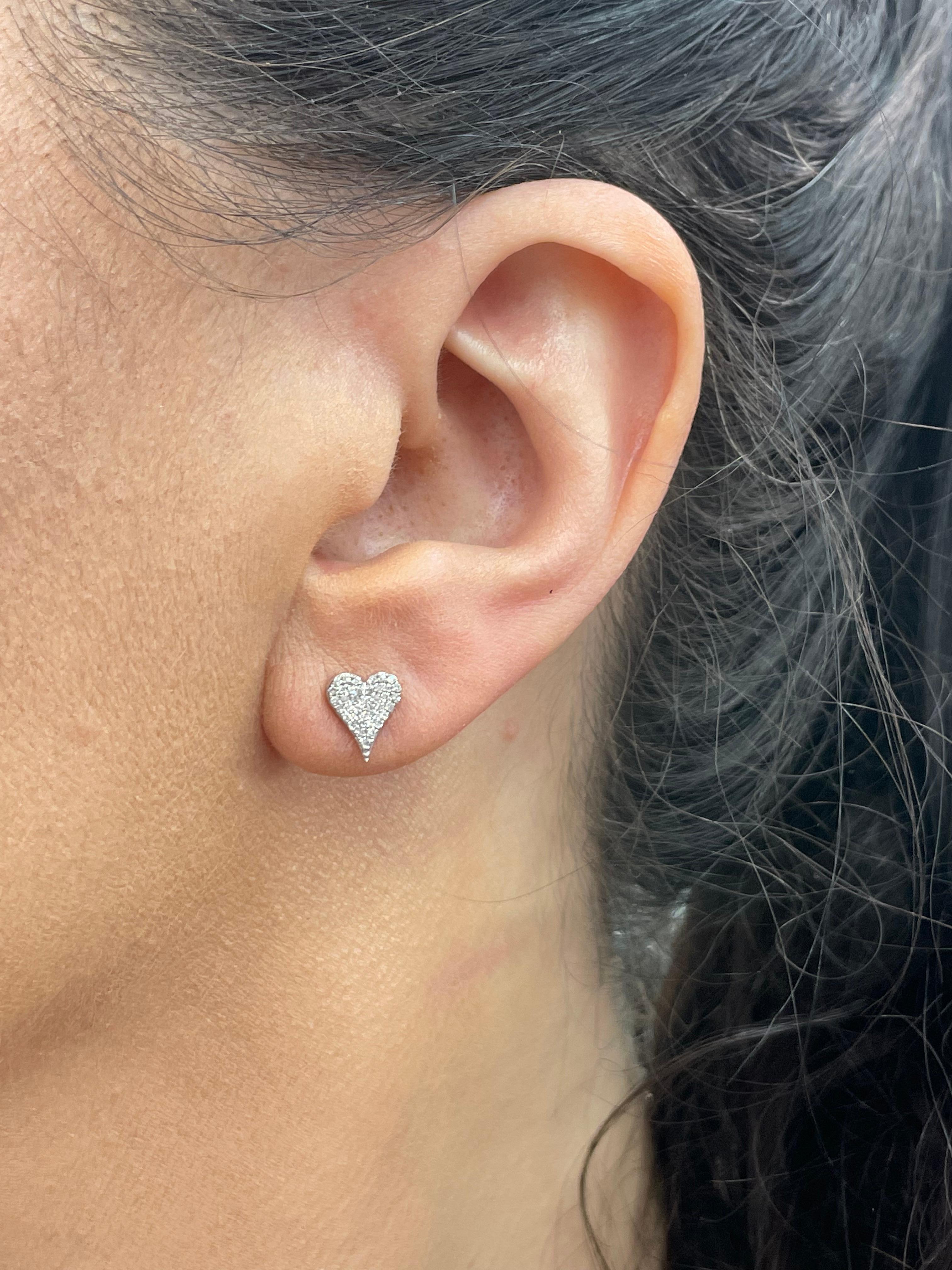 Small heart stud earrings featuring 78 round brilliants weighing 0.20 carats, in 14 Karat White Gold.
Color G-H
Clarity SI

Available in Medium size Yellow Gold
DM for more pictures & pricing. 
Search Harbor Diamonds
