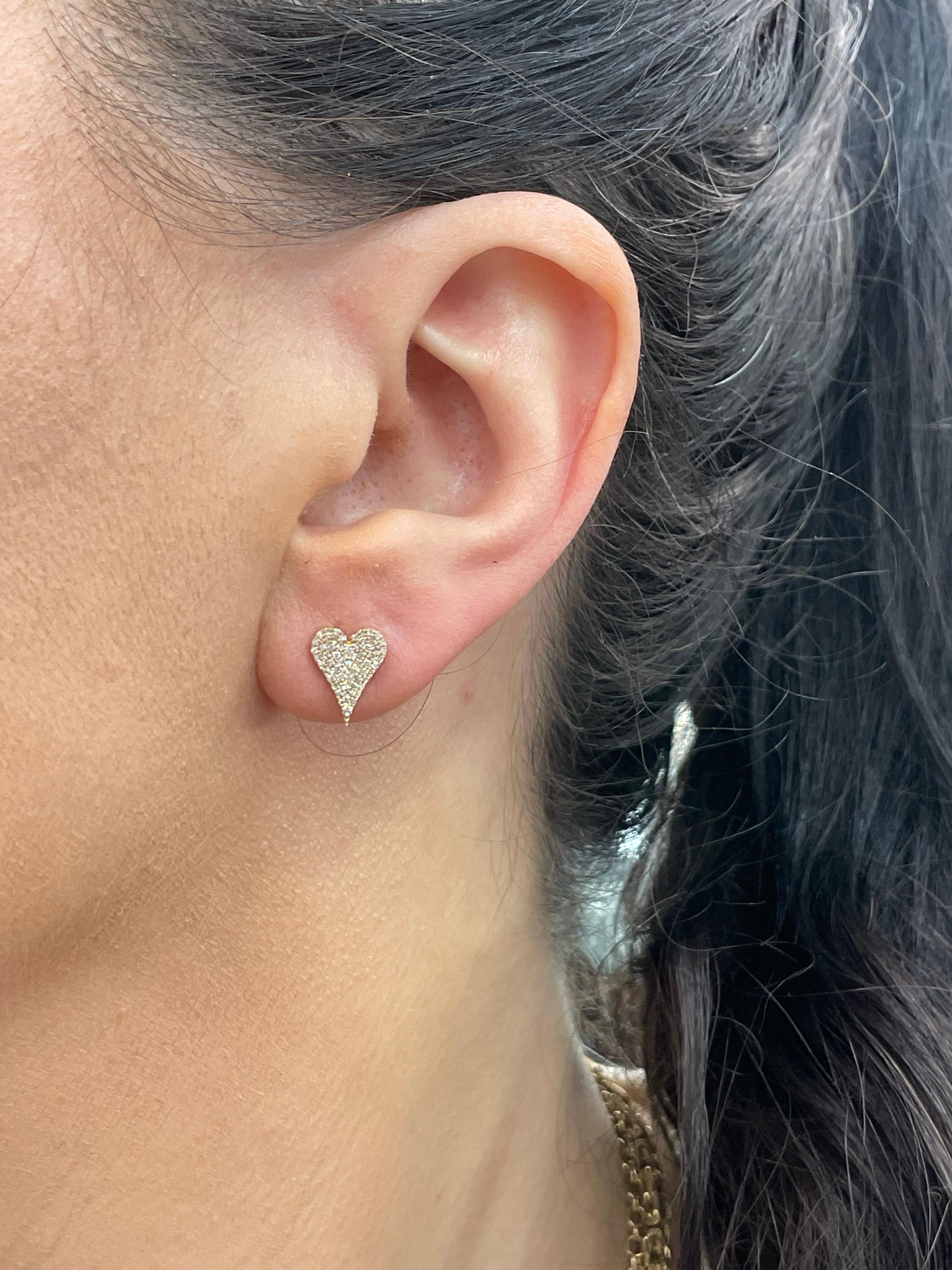 Diamond heart stud earrings containing 118 round brilliants weighing .026 Carats in 14 Karat Yellow Gold. 
Available in a smaller size in white gold

DM for more pictures & videos.
Search Harbor Diamonds. 