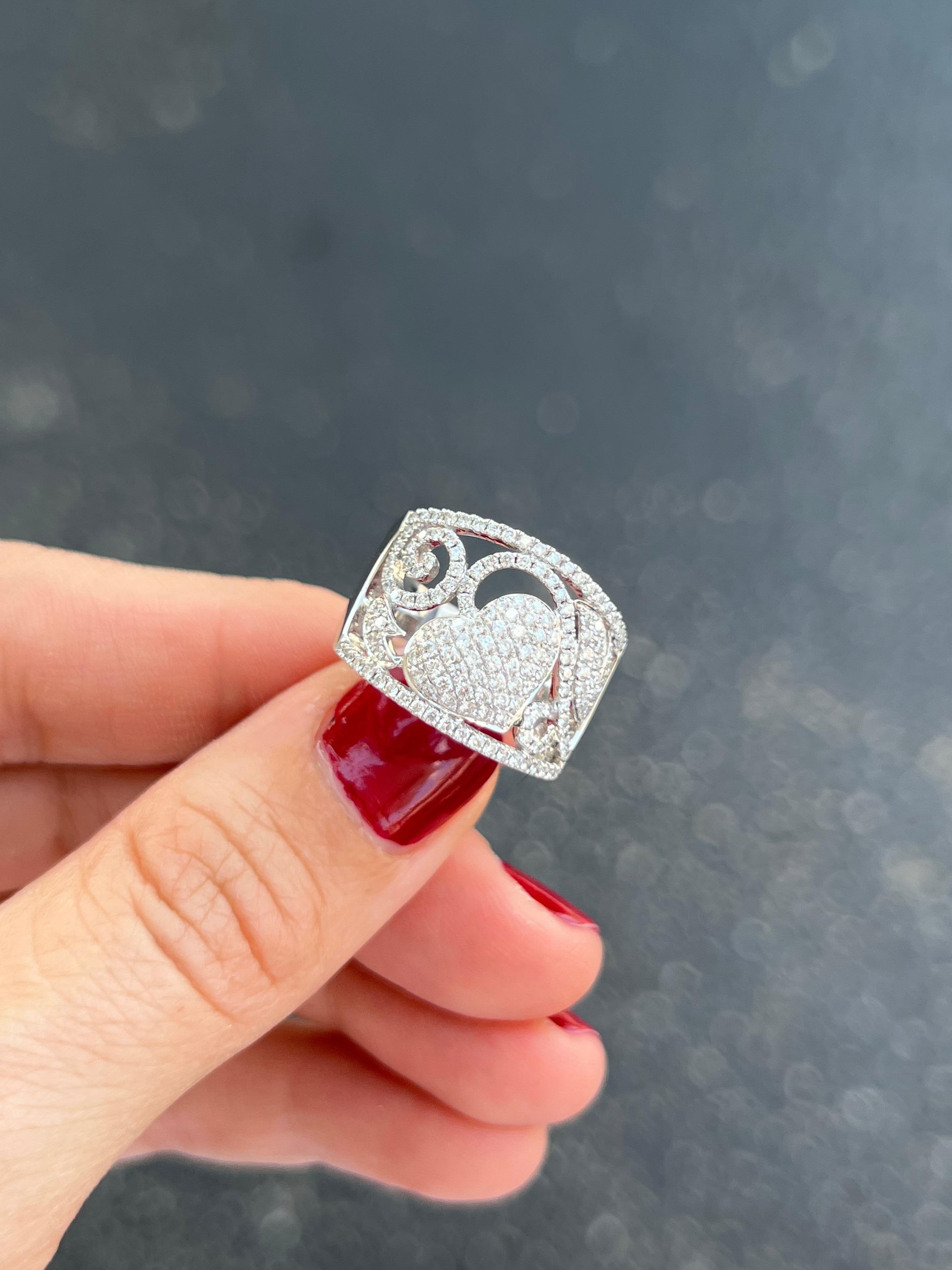 14k white gold diamond pave ring with hearts and vines.

Features
14K white gold
1.01 carat diamonds
Ring size 6.5, can be sized