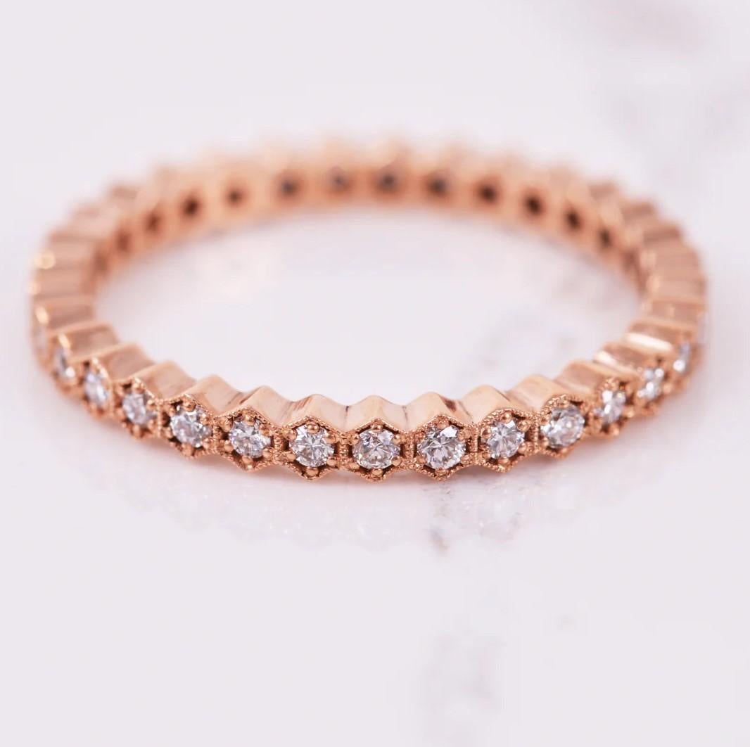 Delicate and stunning! This eternity band consists of .33 carats of diamonds all set in 14k rose gold.This band looks amazing when worn separately or stacked with other bands! Ring size is a 7.

Additional sizes available upon request. Production