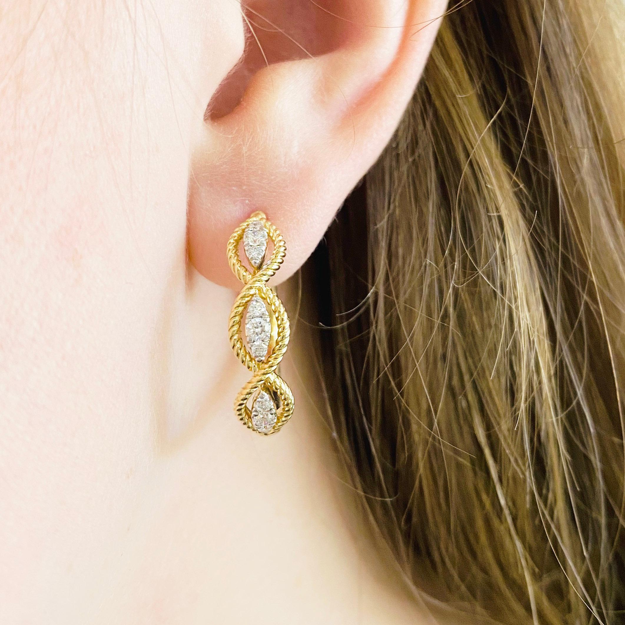 These stunning 14k yellow gold twisted layered 20mm hoops dripping with diamonds provide a look that is both trendy and classic. These diamond earrings are a great staple to add to your collection, and can be worn with both casual and formal wear. 