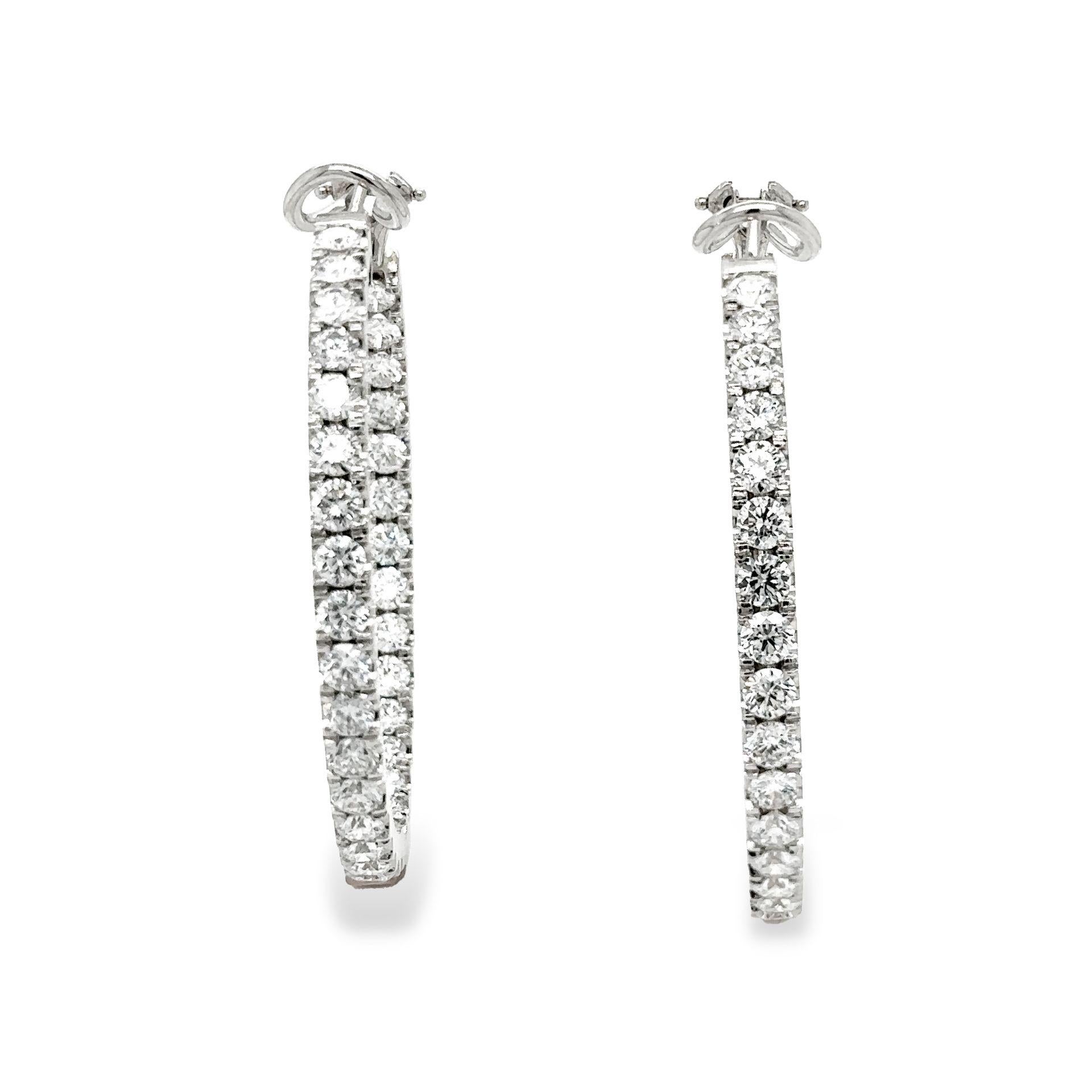 Diamond Hoop Earrings 18K White Gold 7.40 carats

Inside-Outside Hoop Earrings

STUNNING!!!

With 66 Round Brilliant Cut Diamonds, 11 pointers each

Total Carat Weight of Diamonds 7.40 carats

Diamonds are D E  in Color and VVS/VS in Clarity

Hoop