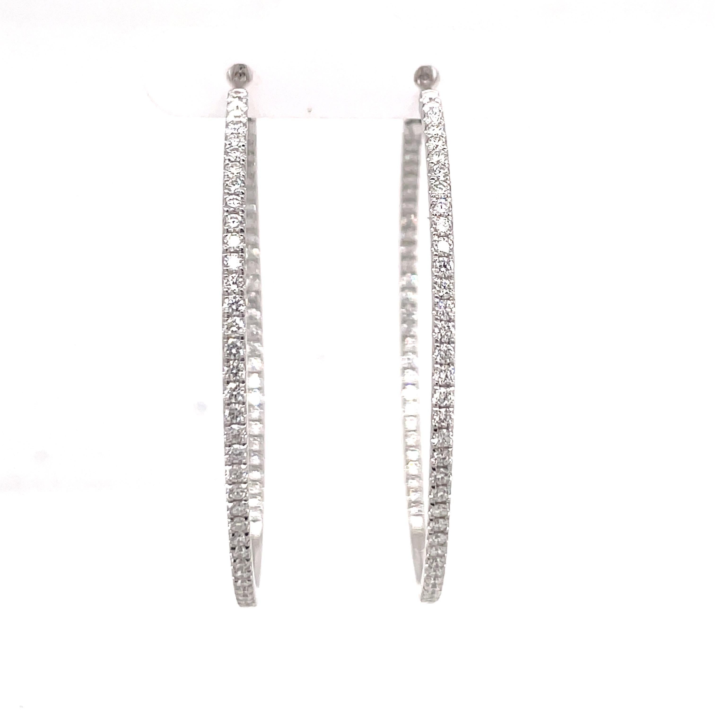 14 Karat white gold hoop earrings featuring 140 round brilliants weighing 2.30 carats. 
Color G-H
Clarity SI

More hoops available in size & gold color.