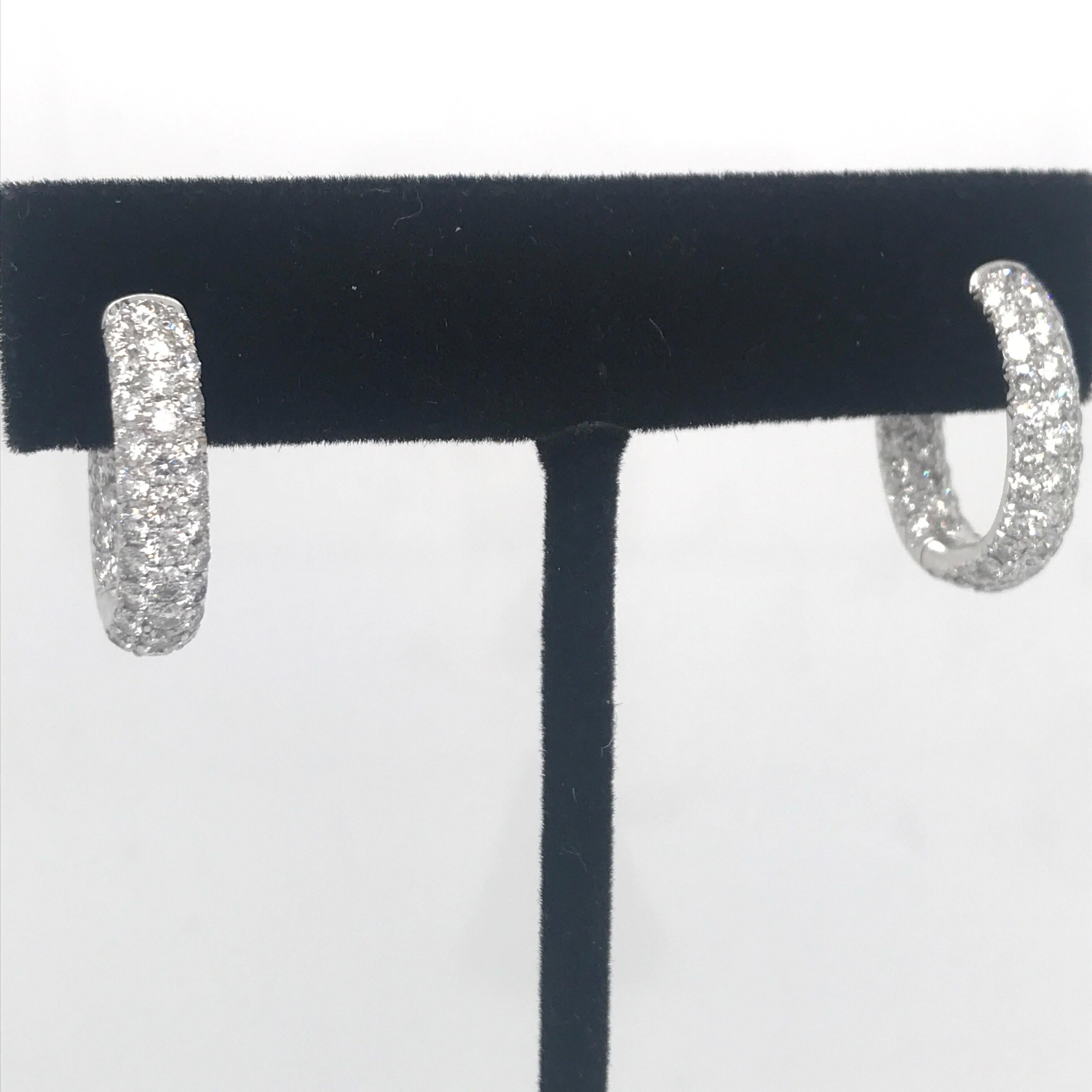 18K White gold hoop earrings featuring 122 round brilliants weighing 2.95 carats. 