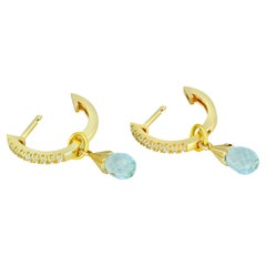 Diamond Hoop Earrings and Topaz Briolette Charms in 14k Gold. 