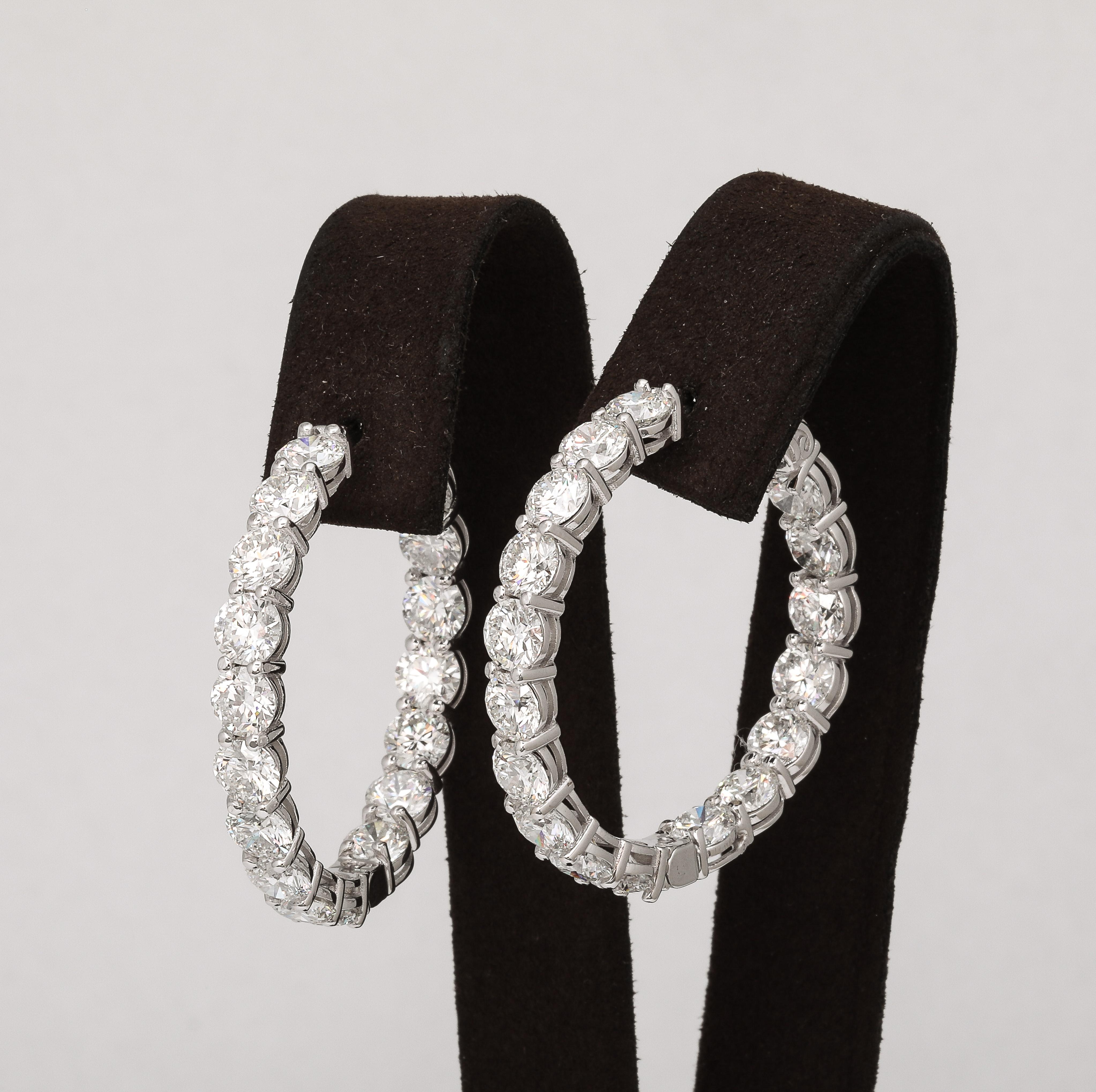 
A fabulous pair of high quality hoop earrings. 

17.25 carats of white round brilliant cut colorless white diamonds set in 14k white gold. 

Each diamond is half a carat!  

1.5 inch diameter. 

Secure push down lock 