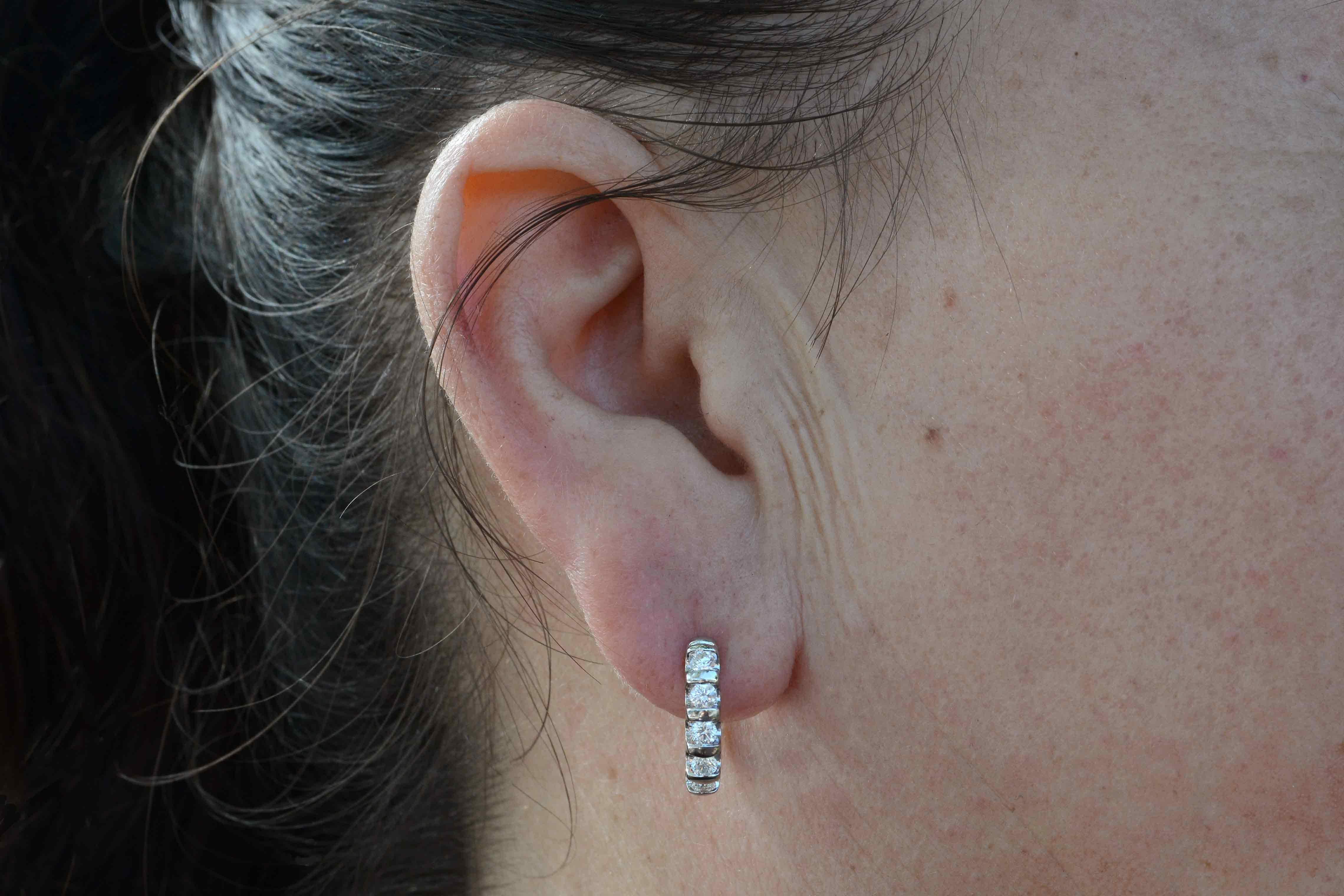 We are excited over these newly-acquired diamond hoop earrings in the popular huggie style. The white, sparkling brilliance of 0.75 carats is near blinding. Set artfully in a semi-channel setting of enduring platinum with a securely locking post