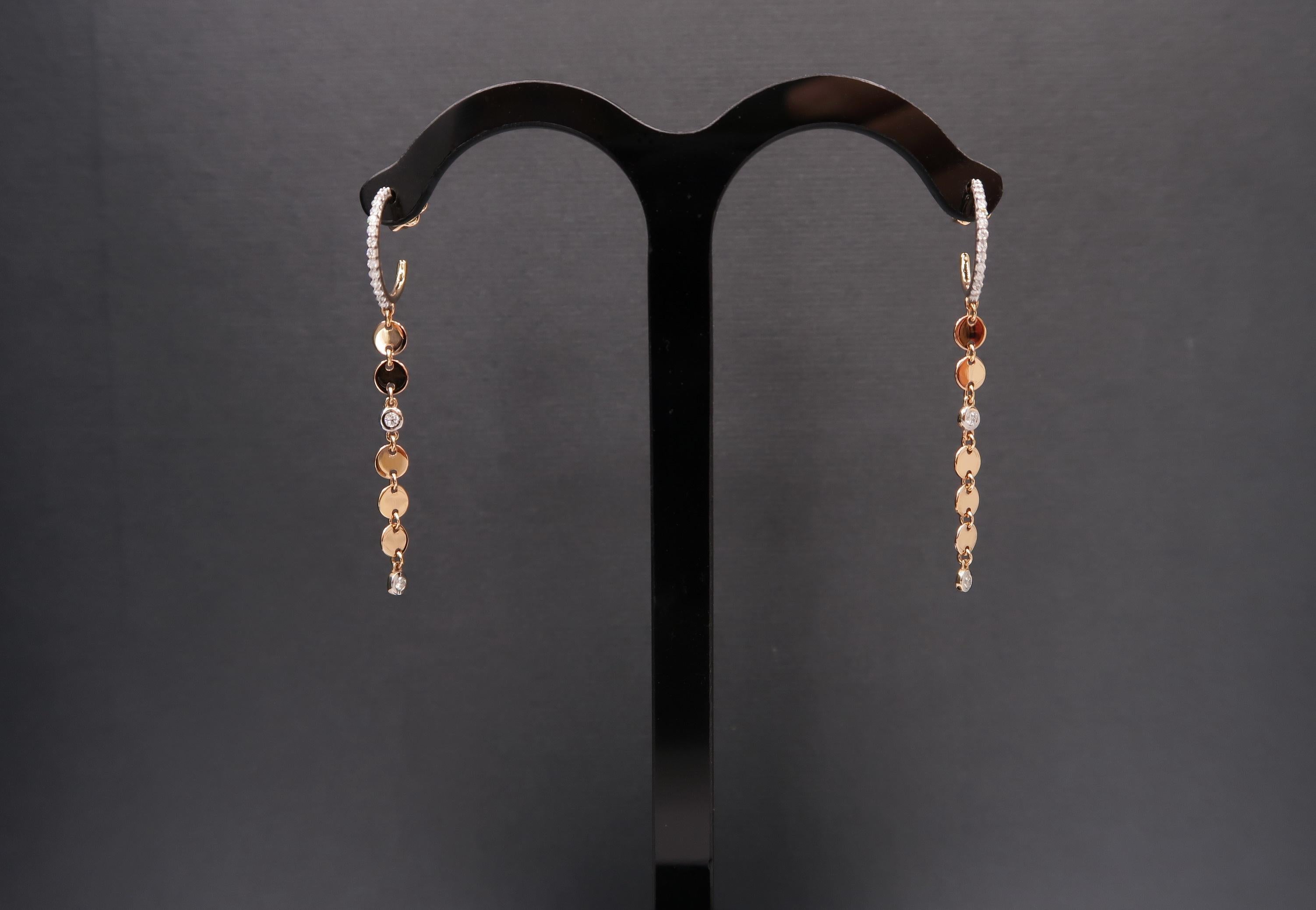 Diamond Hoop Earrings in 18K Rose Gold with Dangling Sequins

Gold: 18K Rose Gold, 3.93 g
Diamond: 0.22 ct

Length: 2 inches