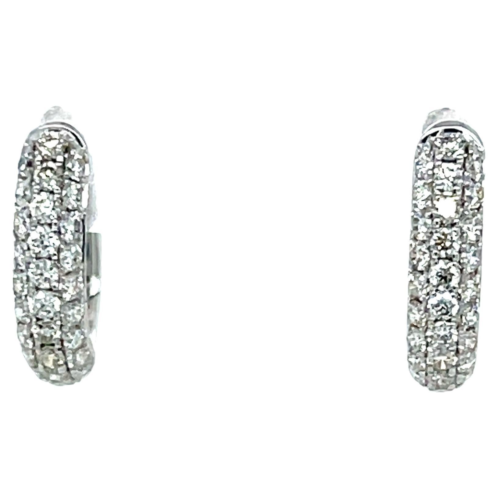 These pretty diamond and 18k white gold hoop earrings will make a perfect gift for yourself or a loved one! Three rows of pave-set white brilliant diamonds weighing nearly a half a carat total adorn these lovely hoops, making them sparkle from every