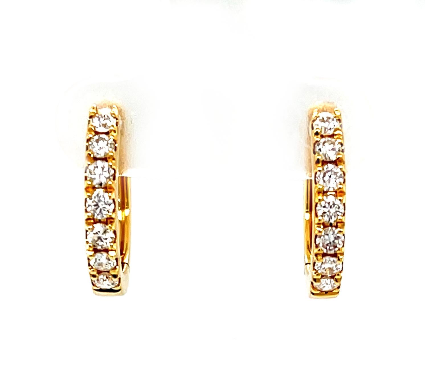 Diamond hoop earrings are a staple in any fine jewelry wardrobe, and this beautiful pair is perfect for both everyday and special occasions! These lovely hoops feature sparkling round brilliant-cut diamonds set in 18k yellow gold and a hinged back