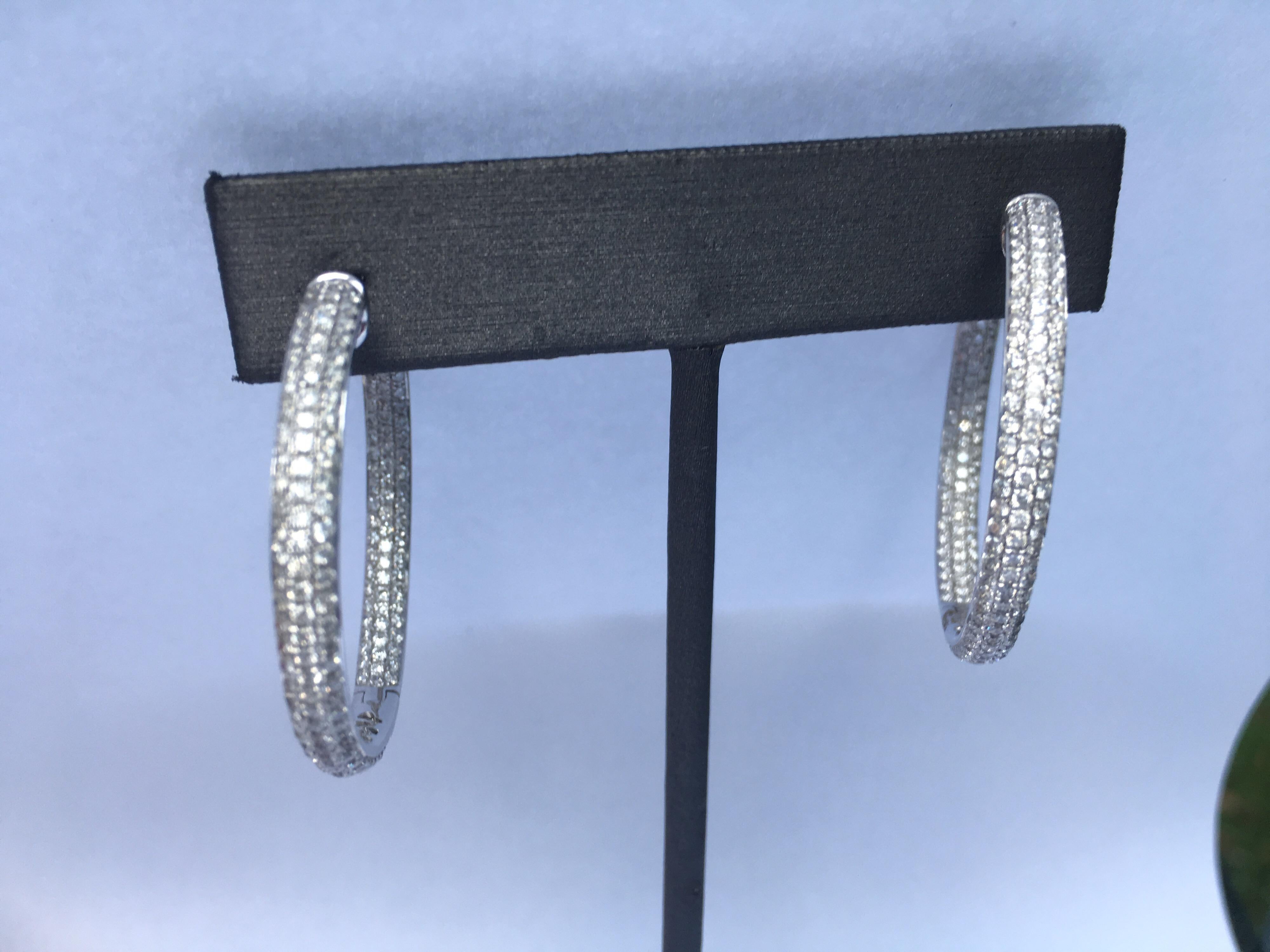Diamond Hoop Earring Set in 18K White Gold. Total Diamond weight is 3.55 Carat. The Earring is 35 MM. The Earring is Hand crafted.
