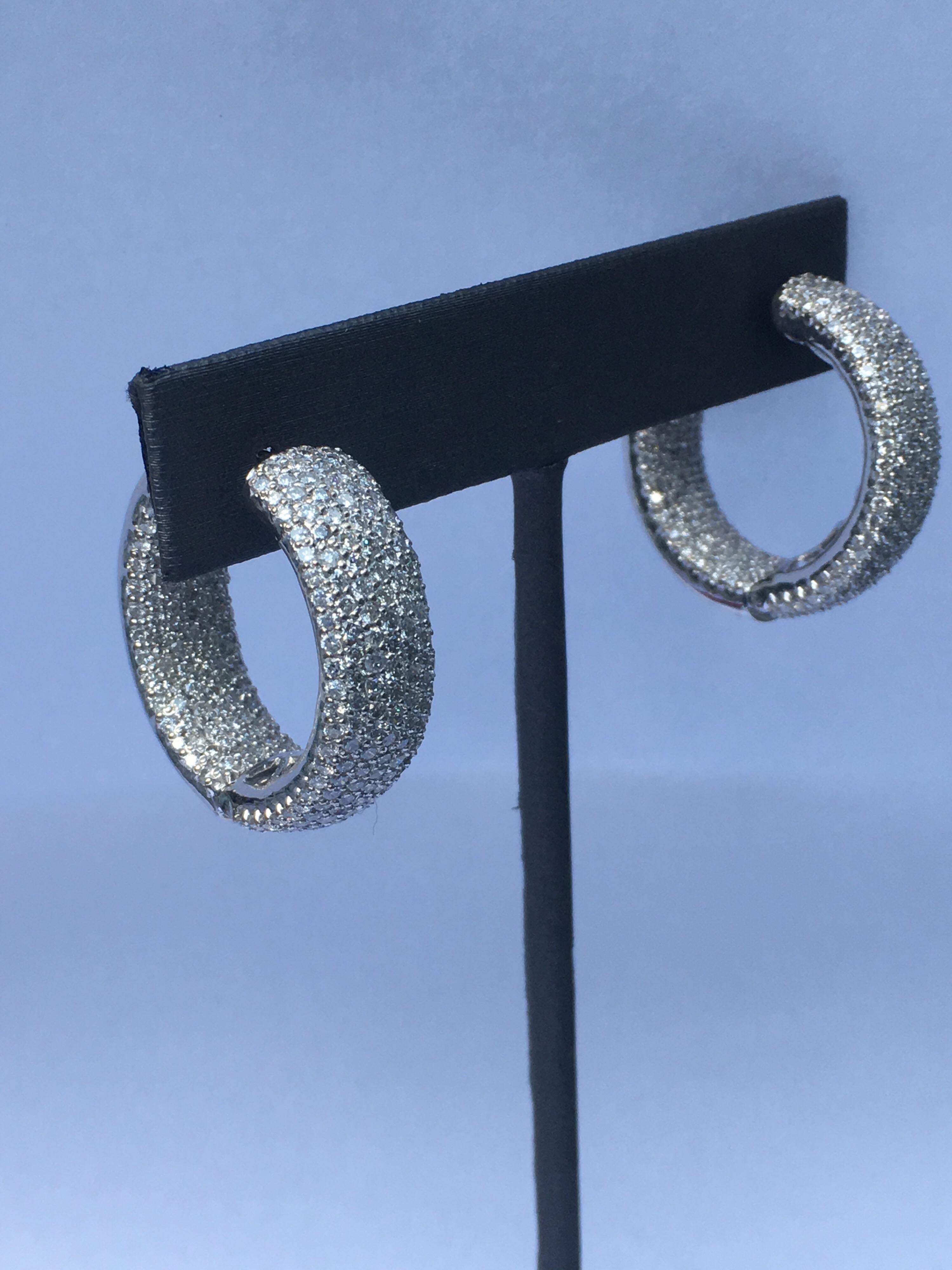 White Round Diamond set in 18K White Gold is one of a kind  hand crafted Hoop Earring. The Diameter of the Earring is 26MM and width of the Earring is 8MM. Total weight of the diamonds 5.83 Carat.